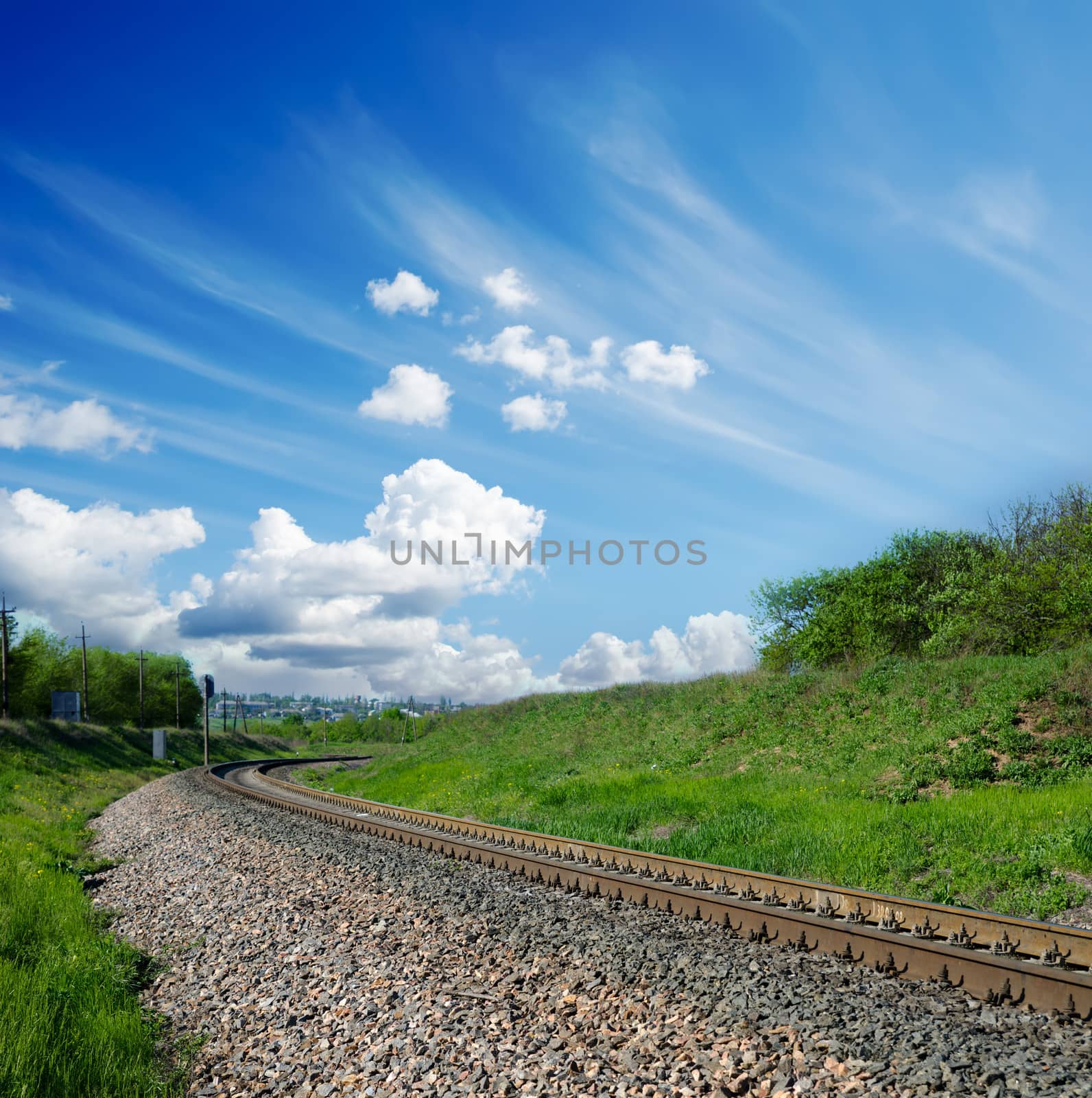 railway under cloudy sky