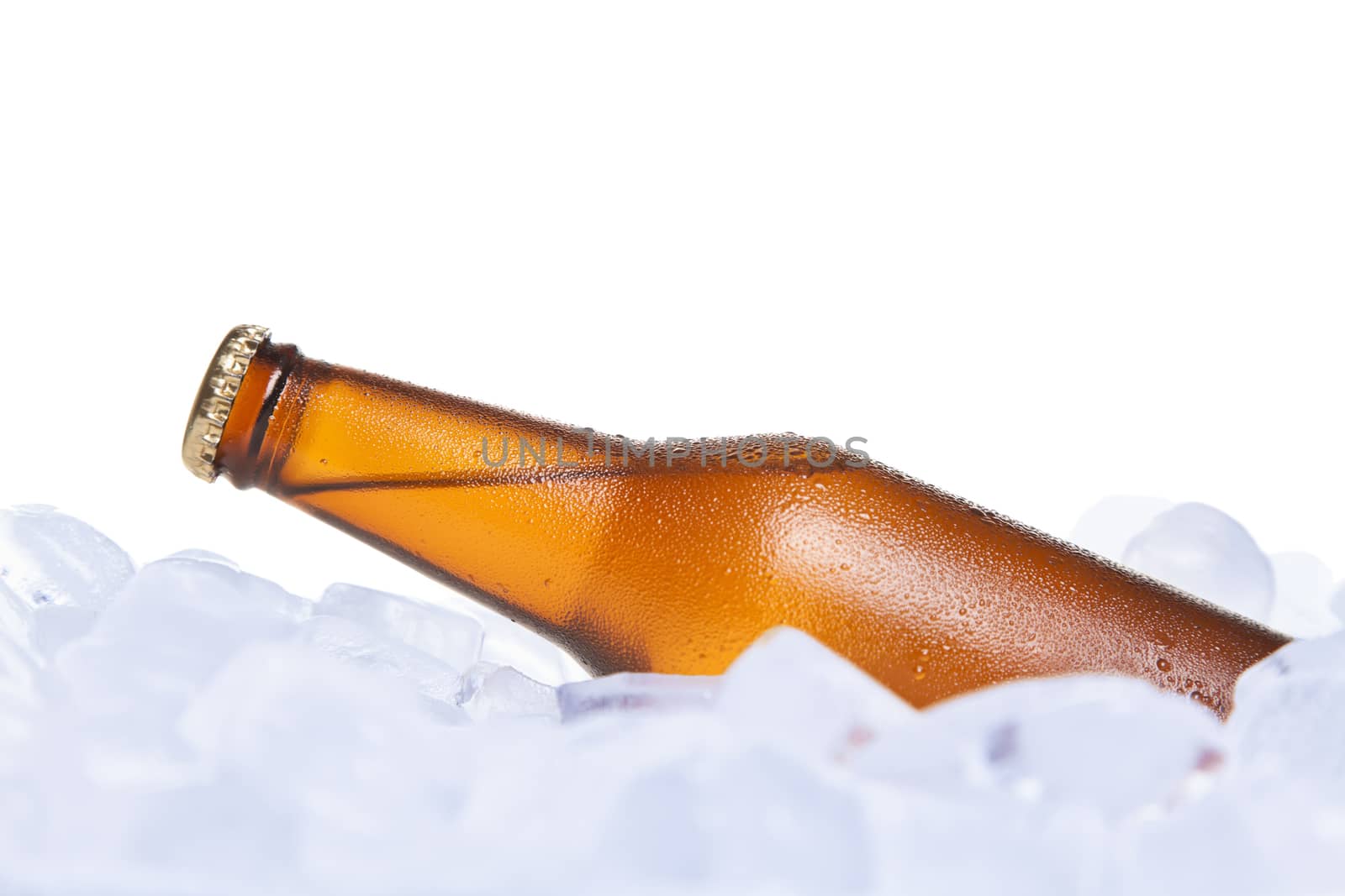 A bottle of beer buried on ice.