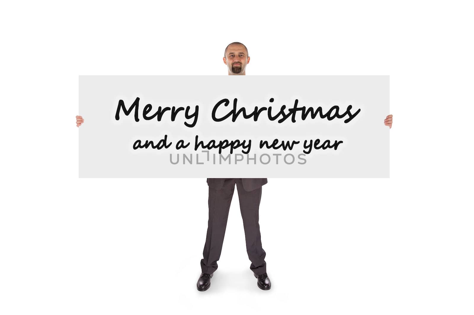 Smiling businessman holding a really big card, isolated on white, merry christmas and a happy new year