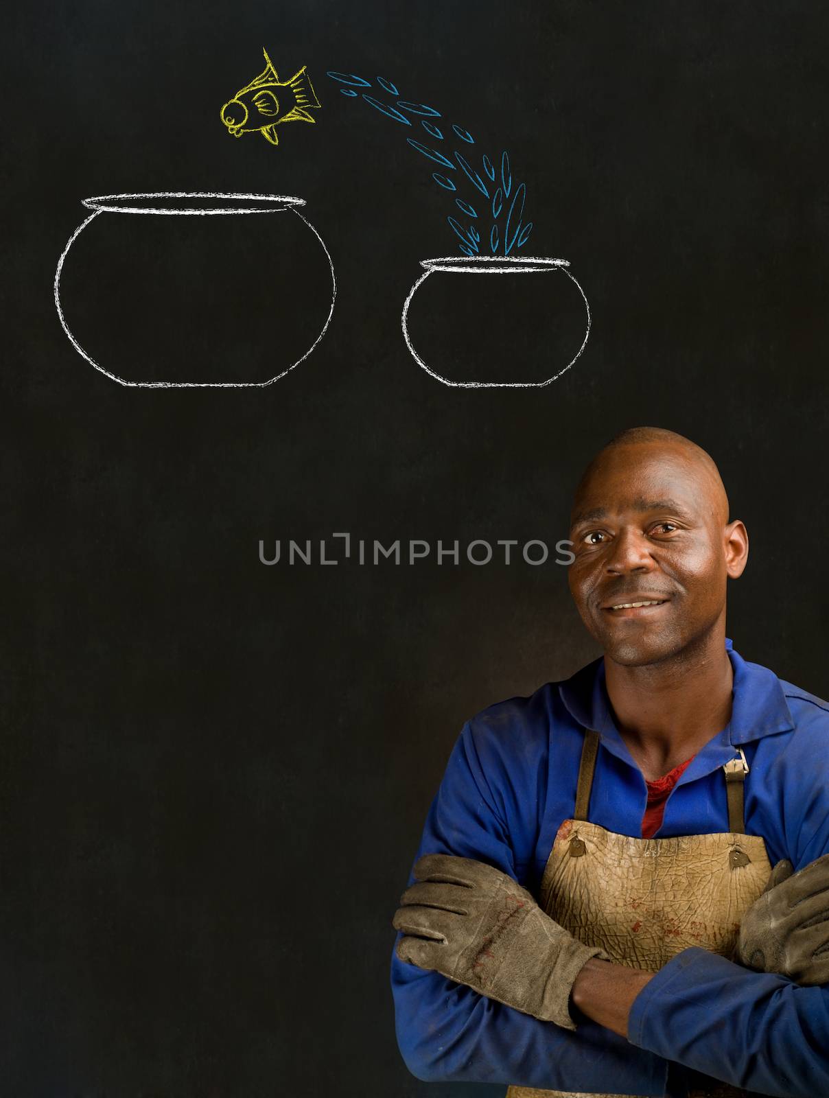 African American black man industrial worker with chalk jumping fish bowls on a blackboard background