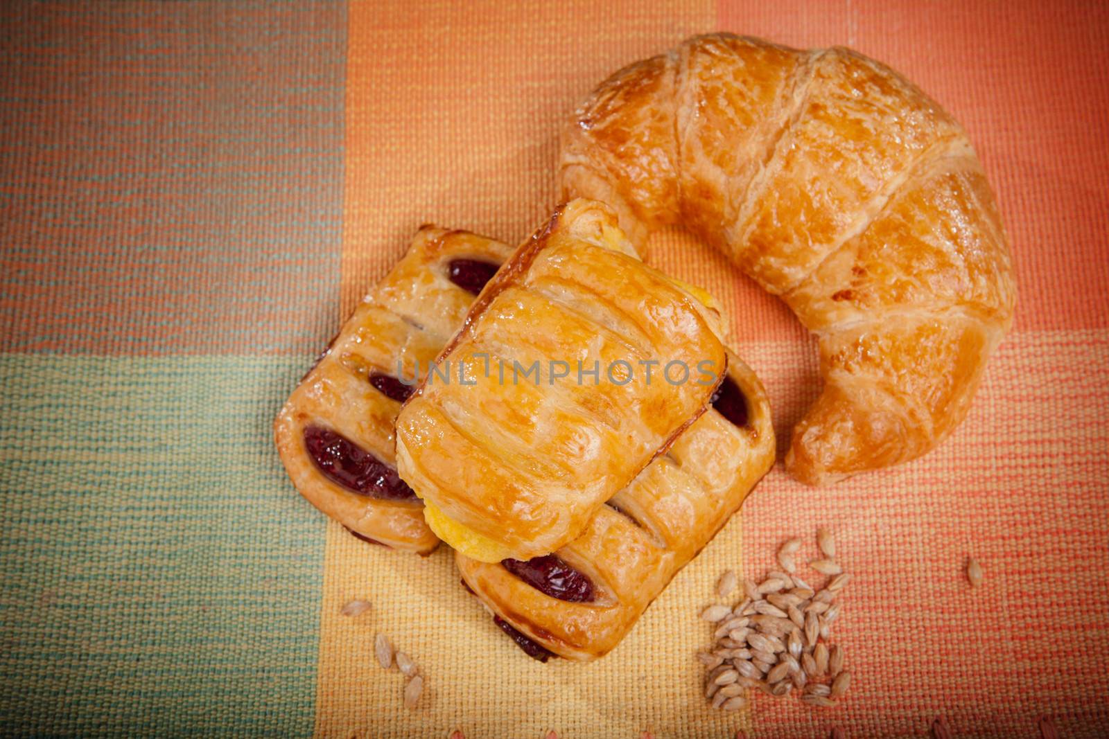 custard cake and croissant bread on natural clothes by khunaspix