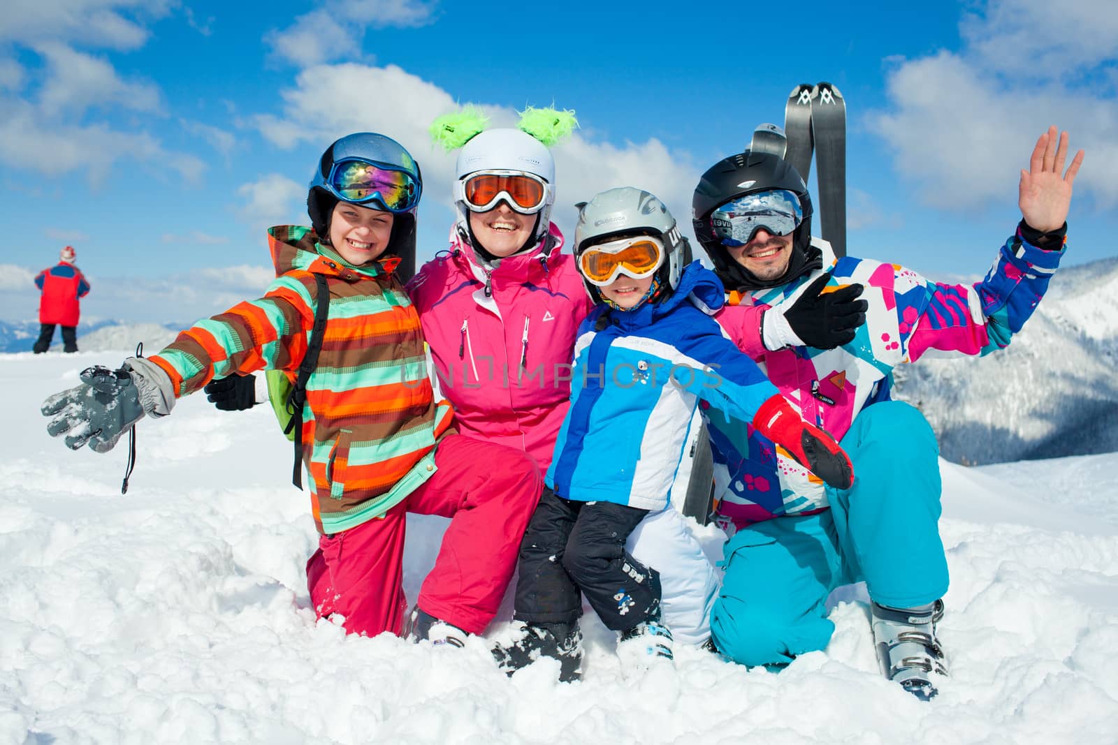 Skiing  winter fun. Happy family by maxoliki