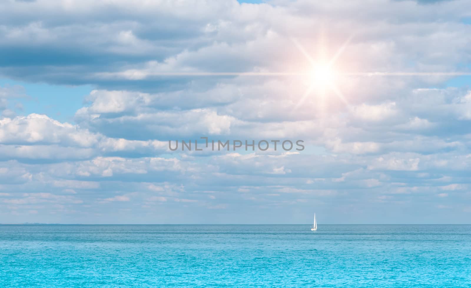 bright sunny day with a boat floating on the sea by Zhukow