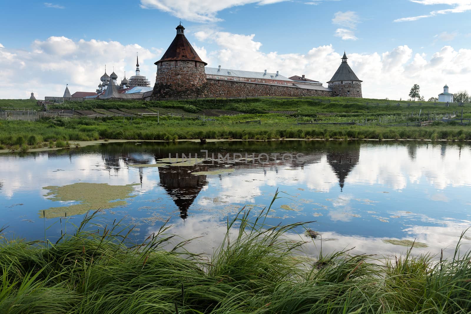 The ancient monastery is reflected in lake. Solovki. Spaso-Preobrazhenskiy solovetsky monastery, Karelia, Russia