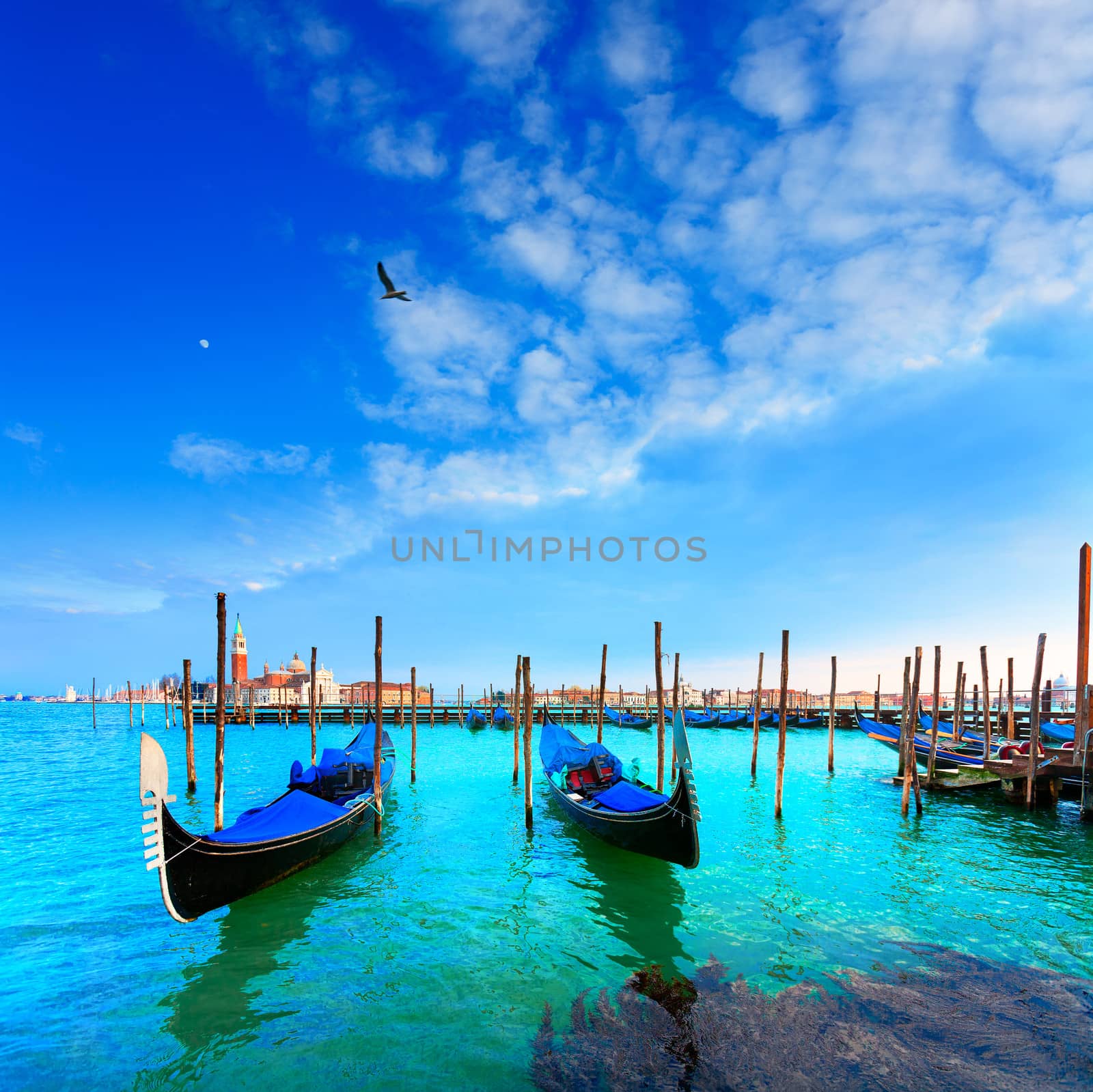  Venice. Gondolas. Canale della Giudecca. San Giorgio Maggiore. Venice is a city in northeast Italy which is renowned for the beauty of its setting, its architecture and its artworks. It is the capital of the Veneto region.