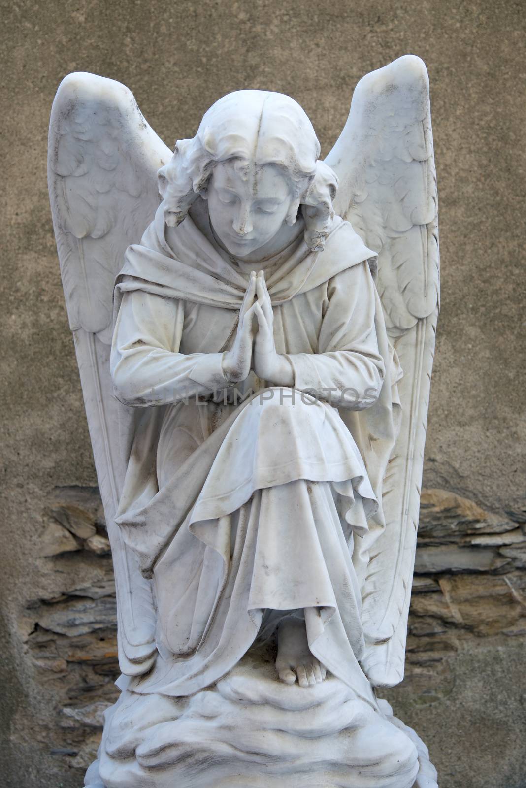 Marble sculpture of angel on a tombstone