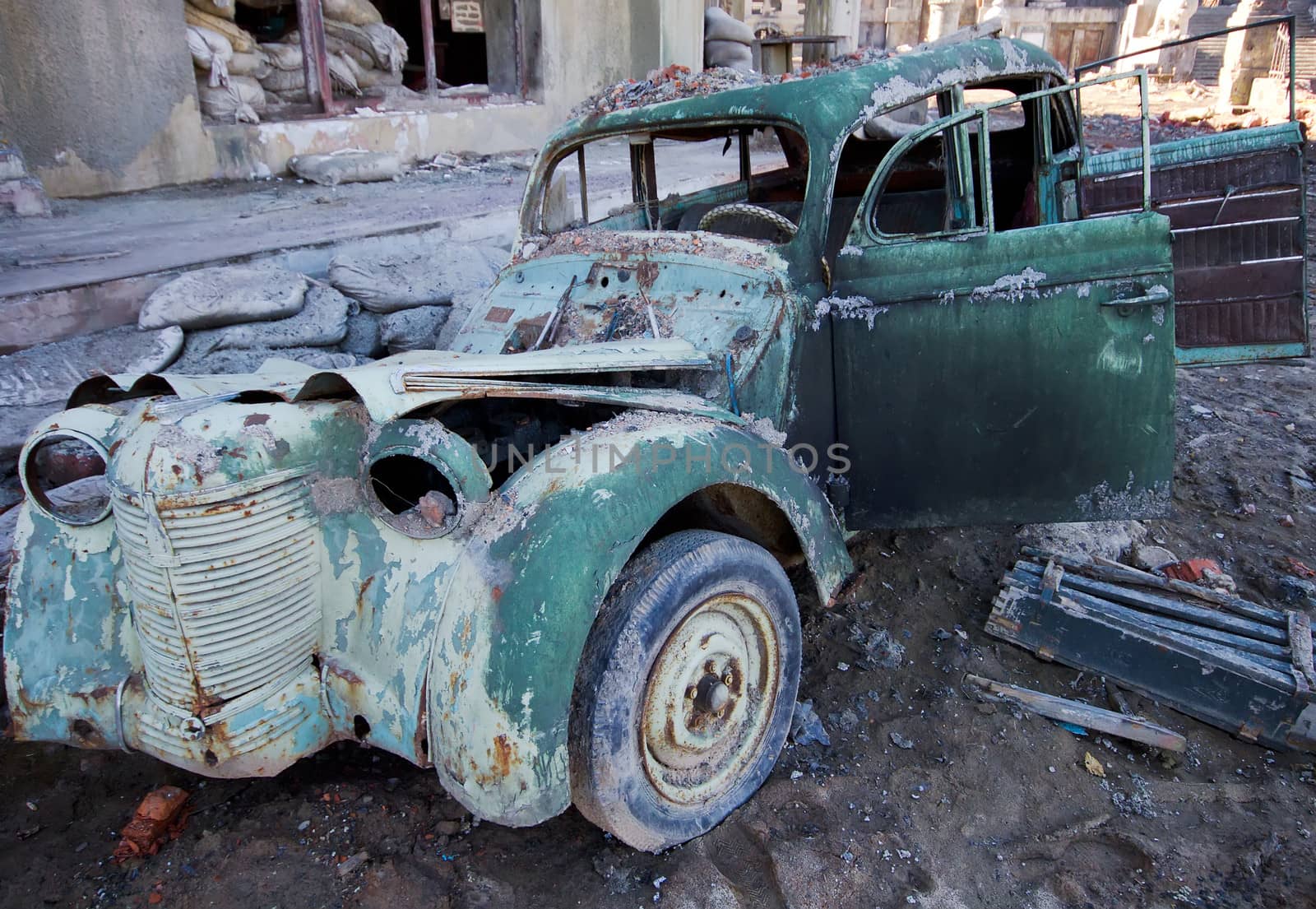 the ancient collapsed car among ruins