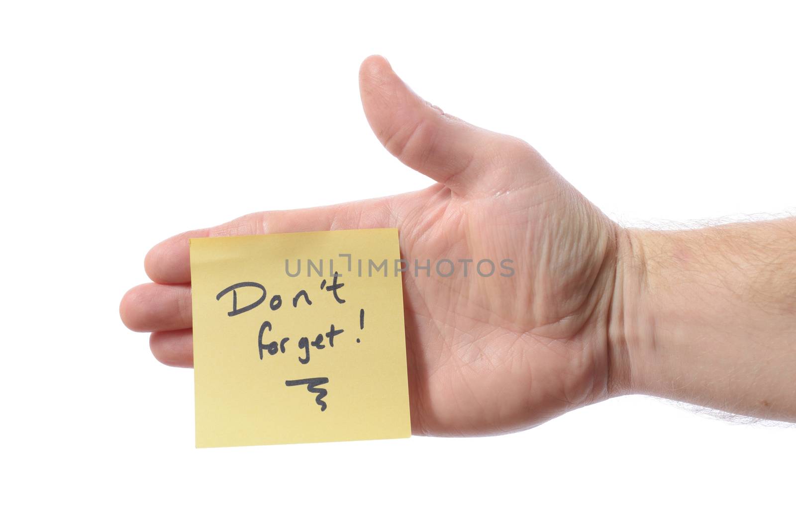 post it note with don't forget as a reminder note on hand isolated on white