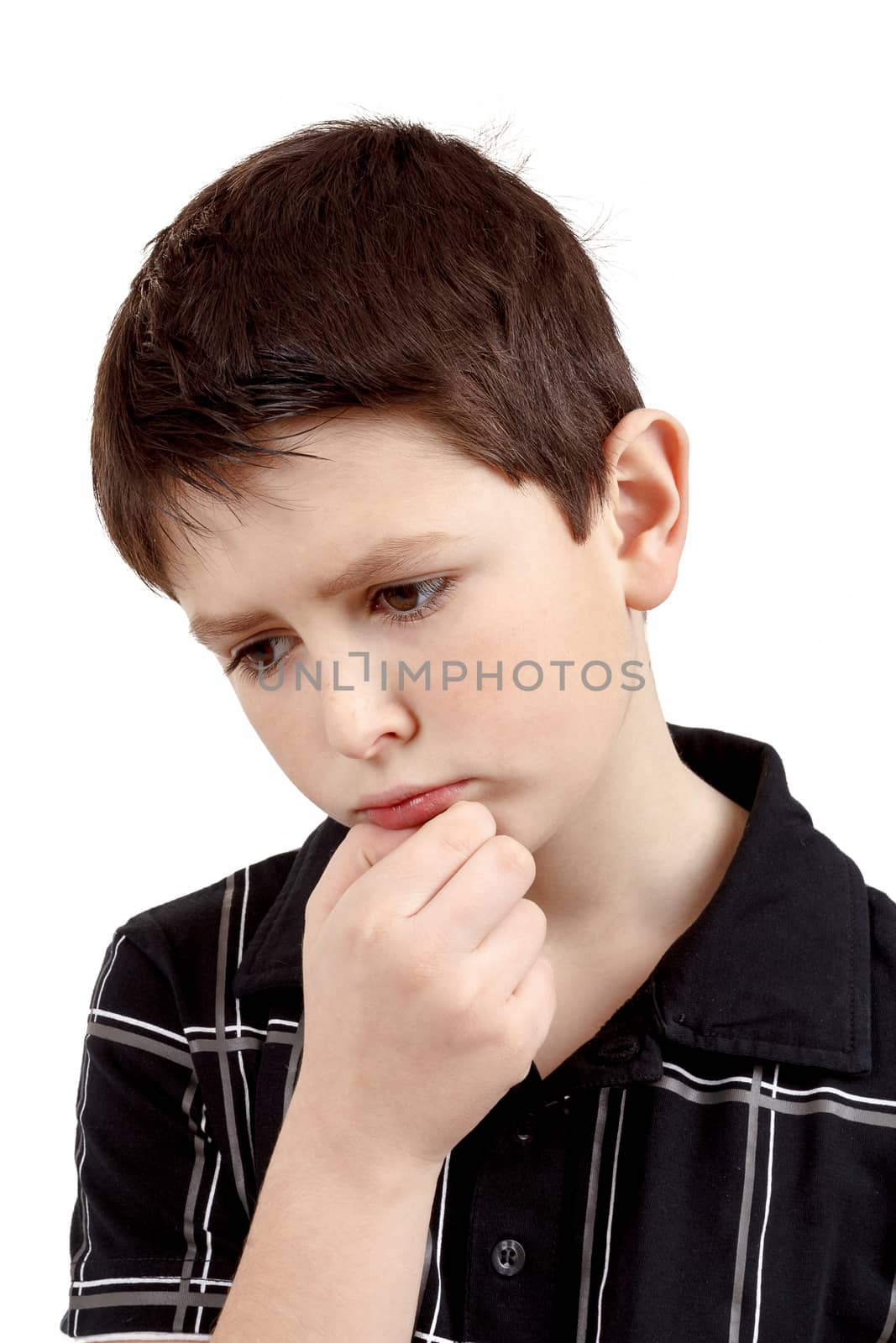 pensive young boy with hand on head isolated on white background