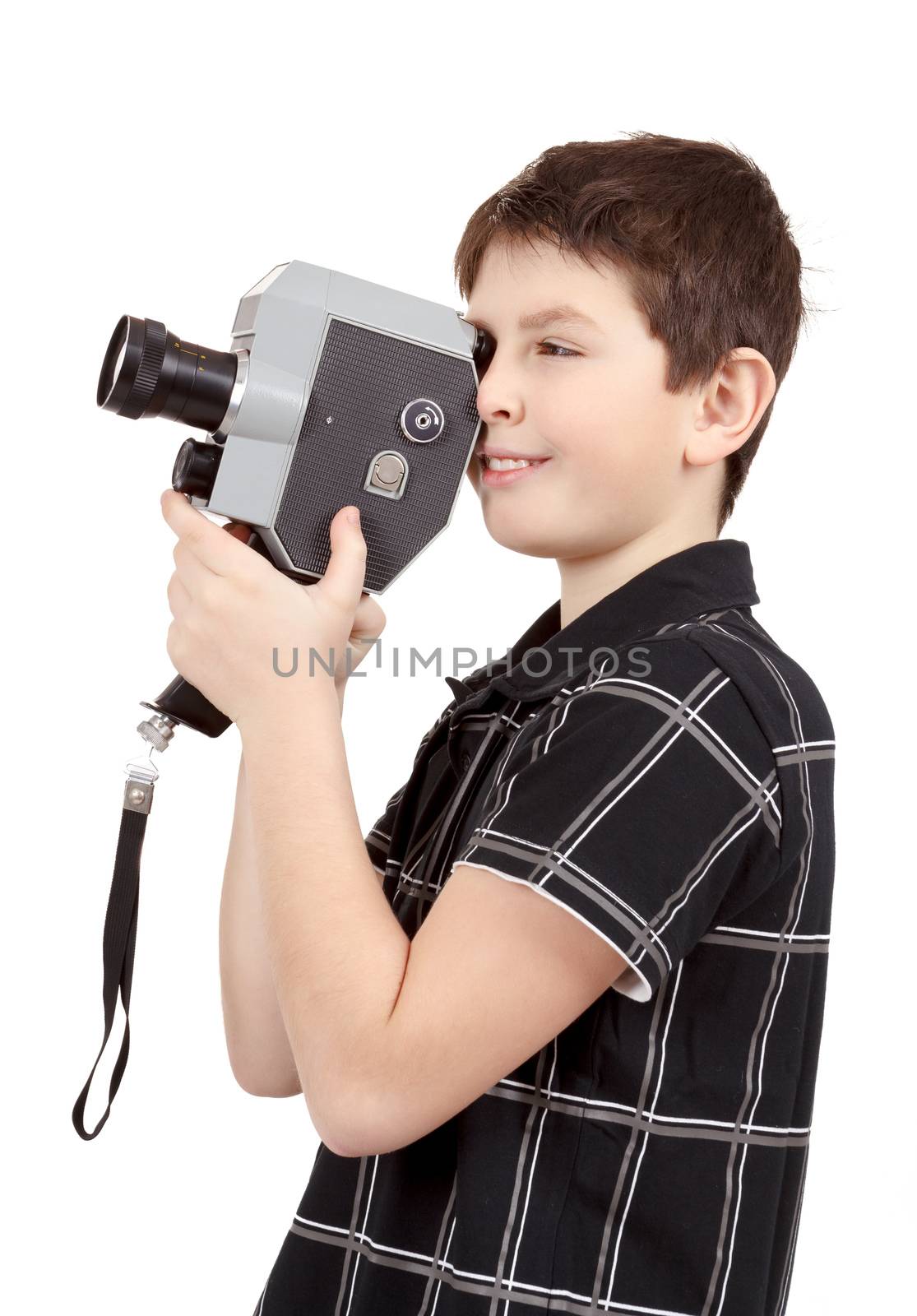 young boy with old vintage analog 8mm camera looking to viewfinder