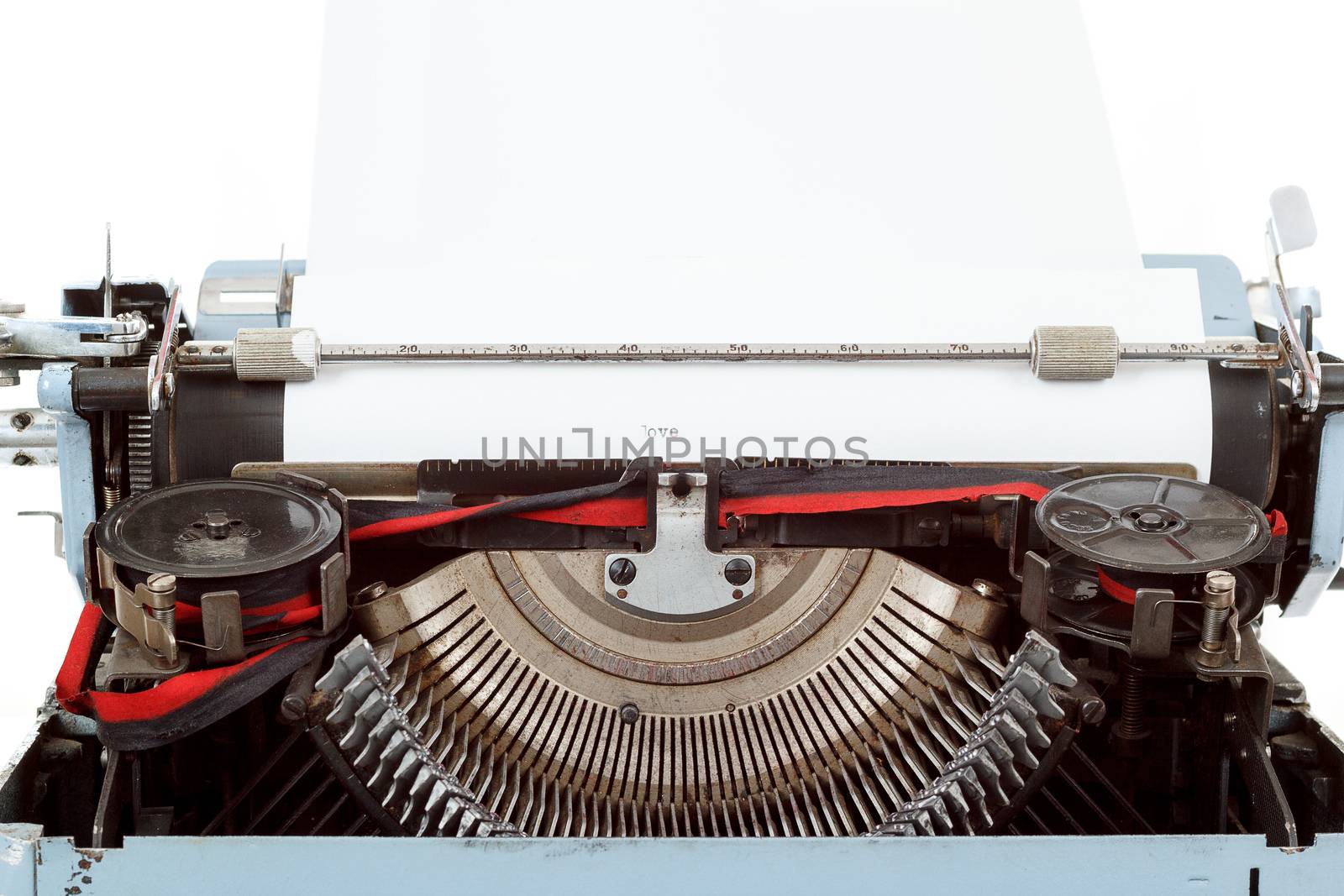 retro typewriter close up with paper and letters mechanism