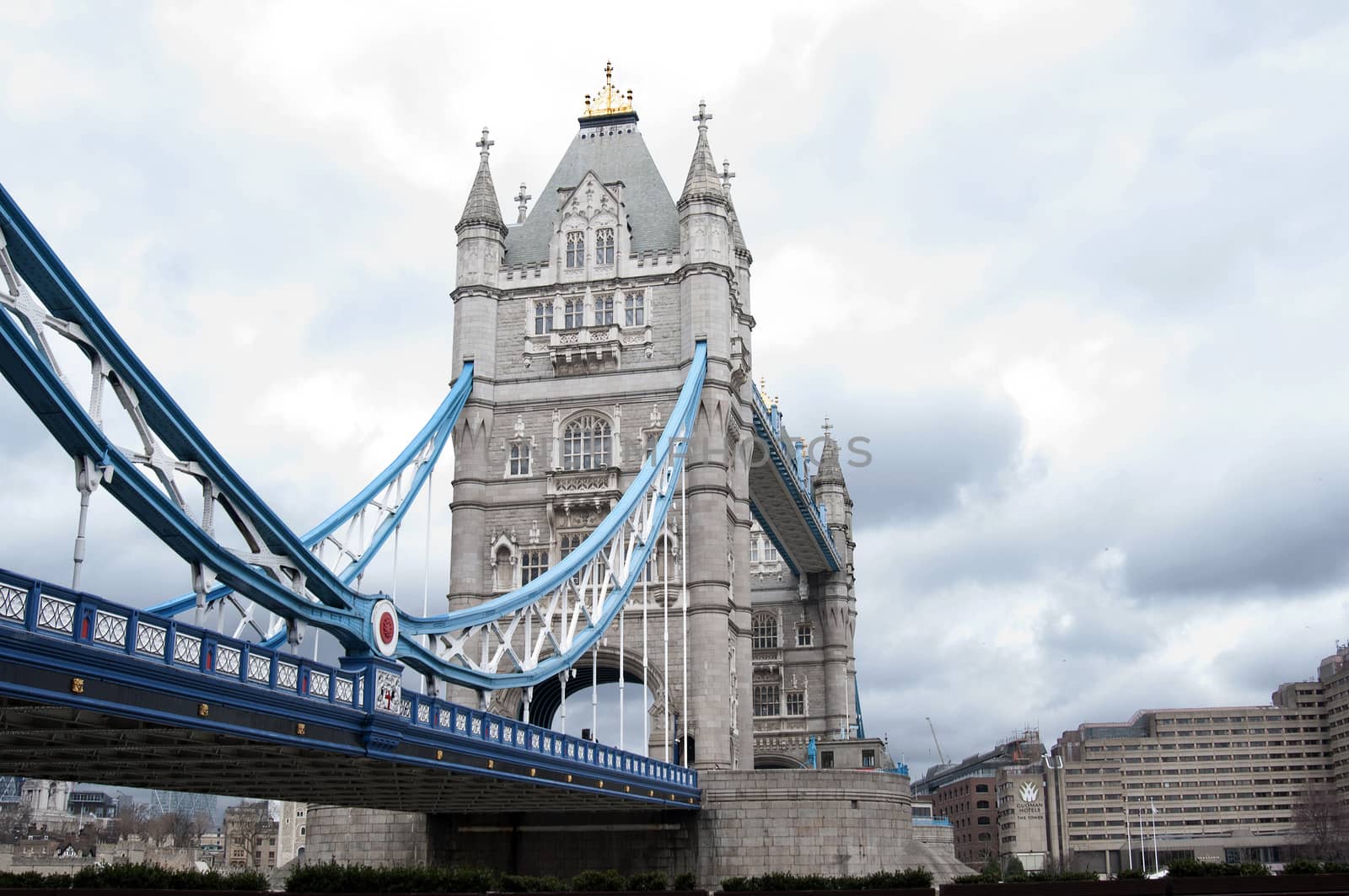 Tower Bridge (built 1886–1894) is a combined bascule and suspension bridge in London which crosses the River Thames. It is close to the Tower of London, from which it takes its name, and has become an iconic symbol of London.