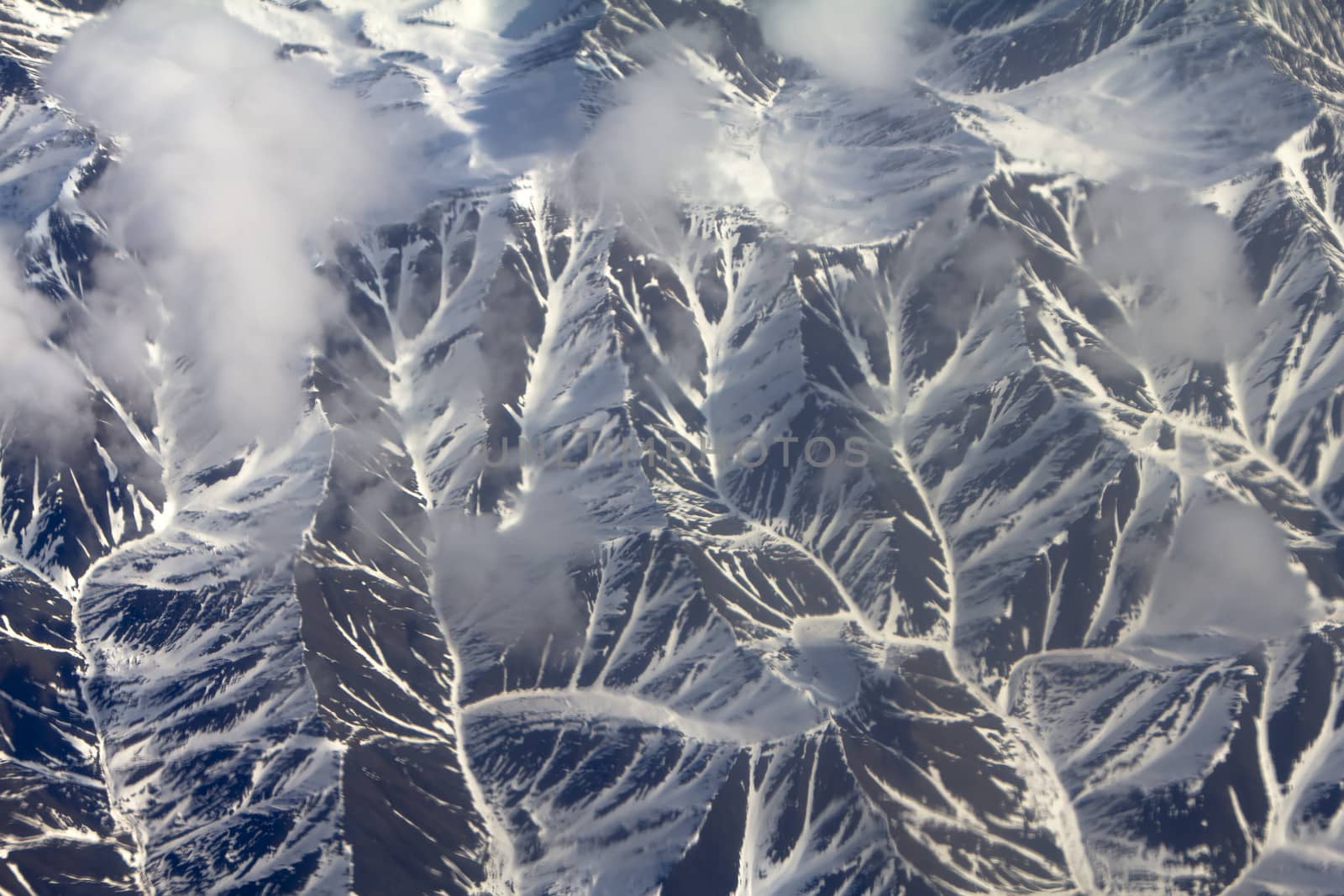 Pattern of snow, clouds and stones: view from height. by max51288