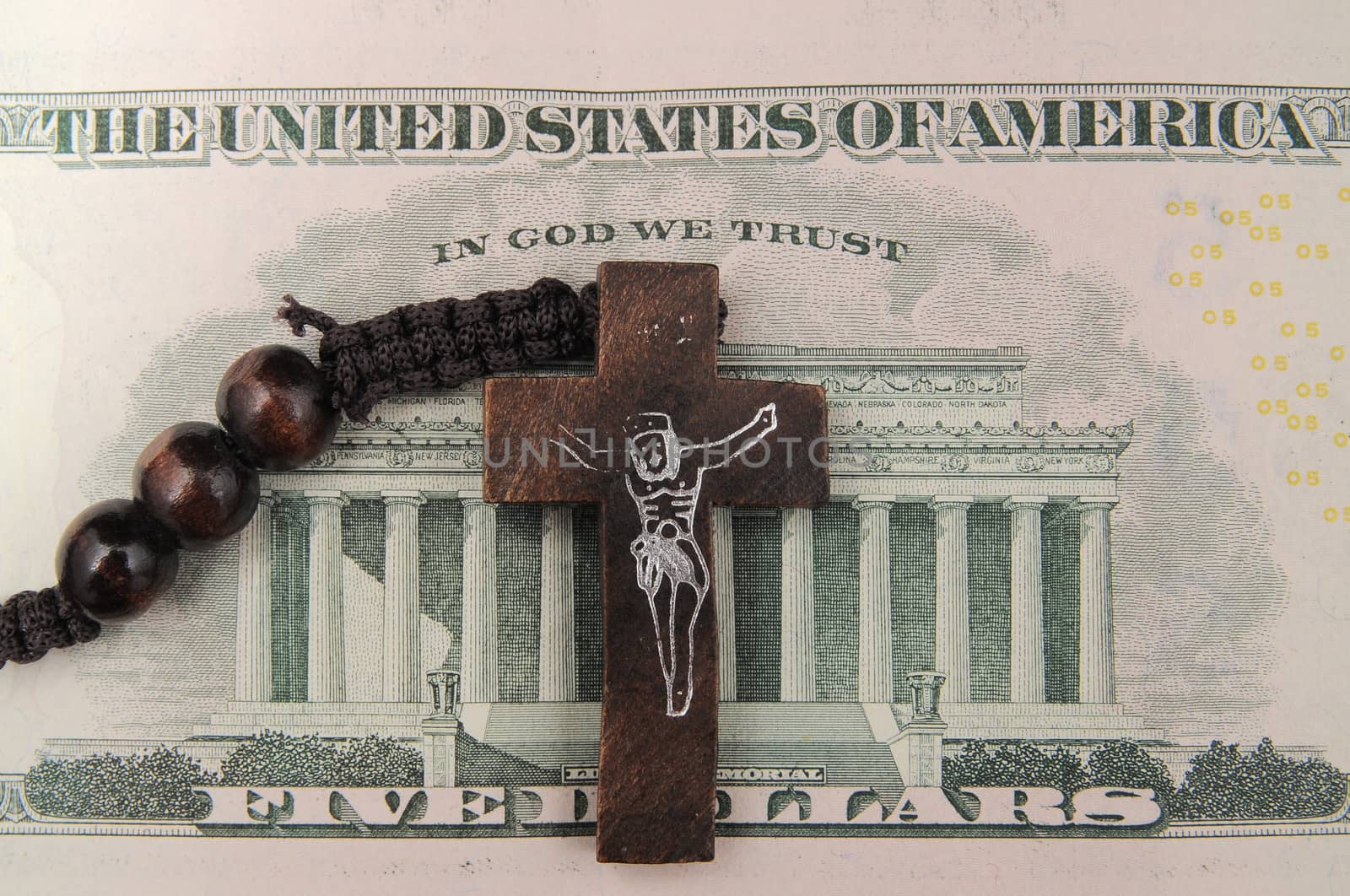 Jesus Christ and Money on a Dark Background - Religion Concept