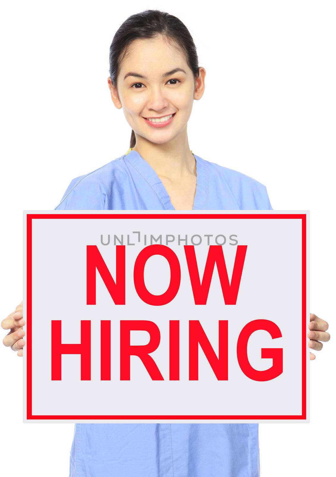 A medical person holding a recruitment sign