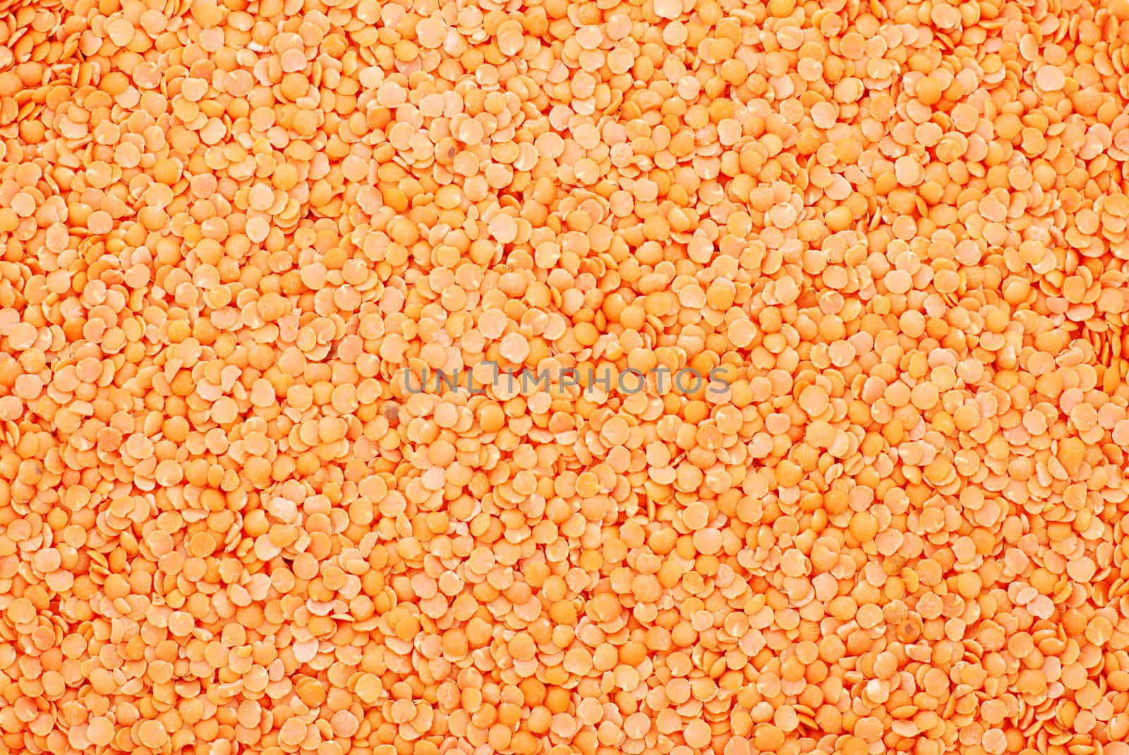 Red lentils abstract background texture
