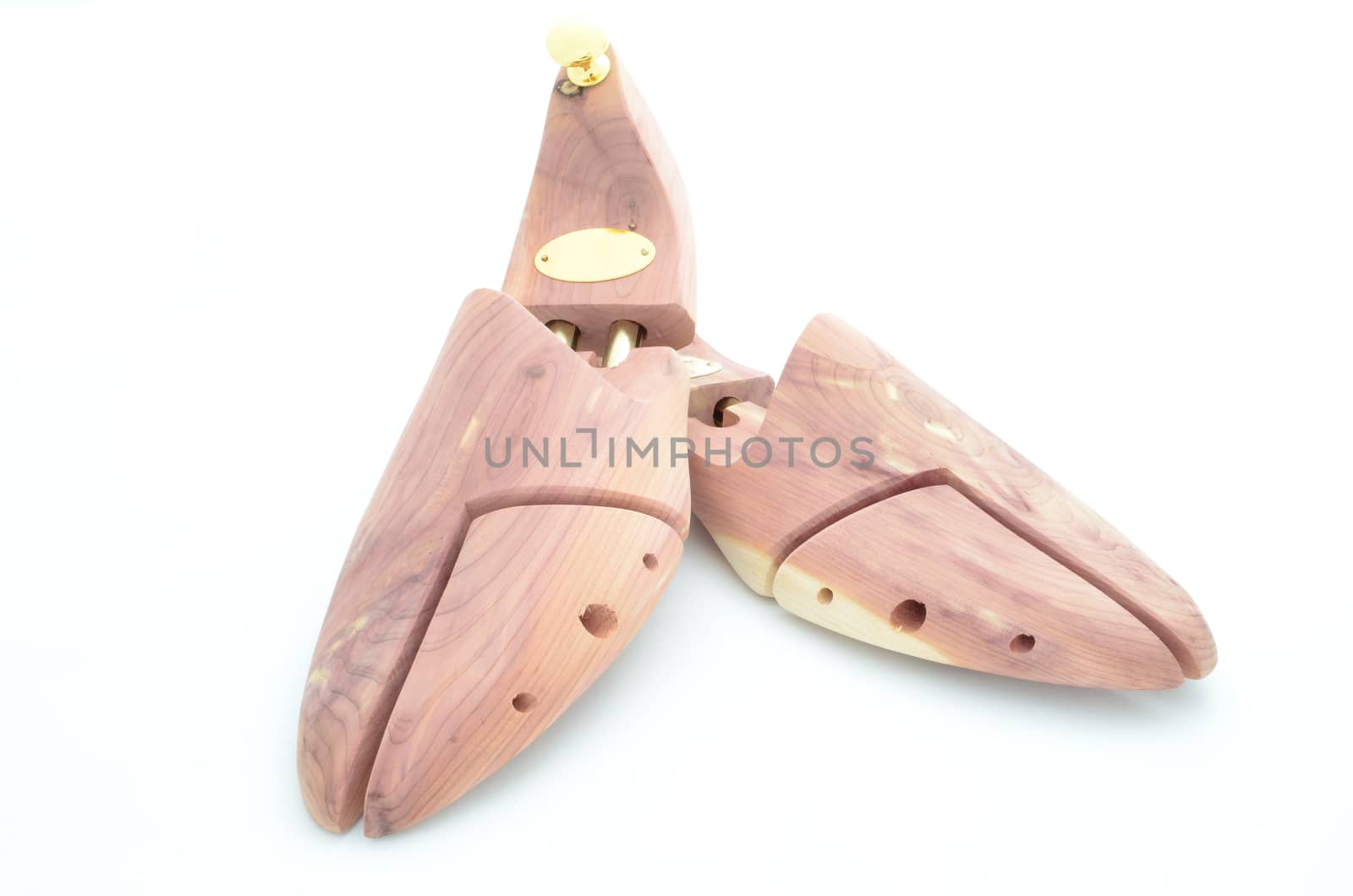 A pair of cedar wood shoe trees. These are luxury fashion accessories for men to keep the shoes in good shape.