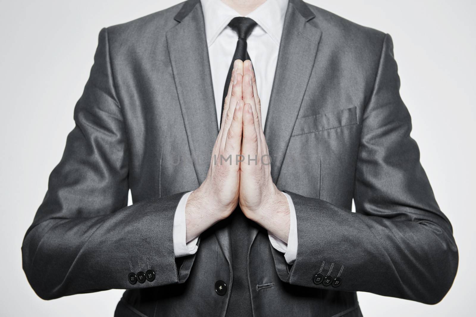  hands of businessman set in pray