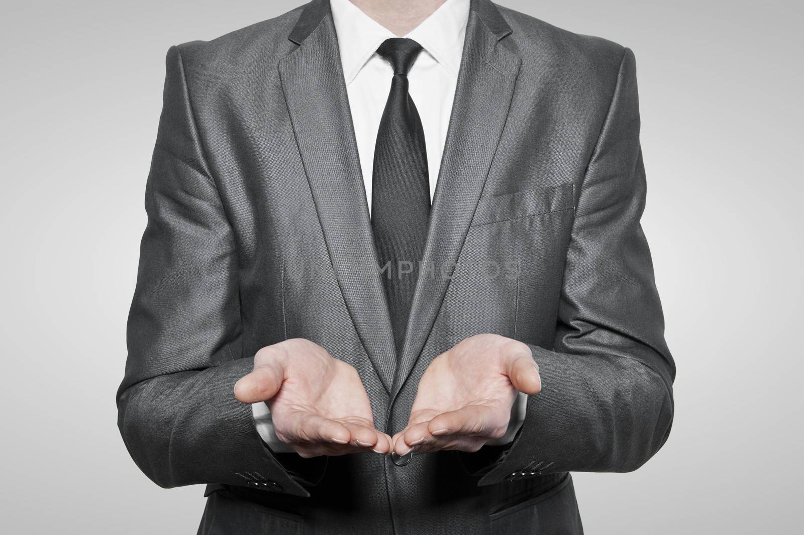 Businessman empty open cupped hands, over white background
