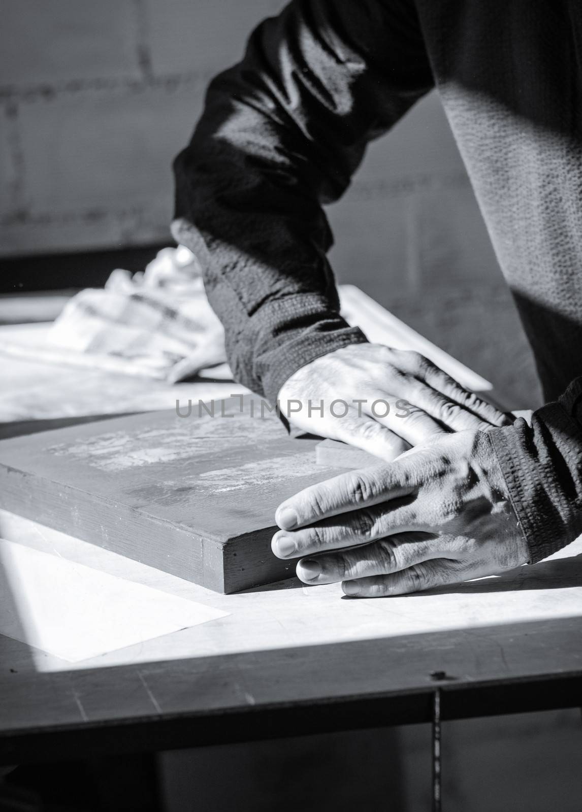 Painter artist working with hands on a oil canvas texture