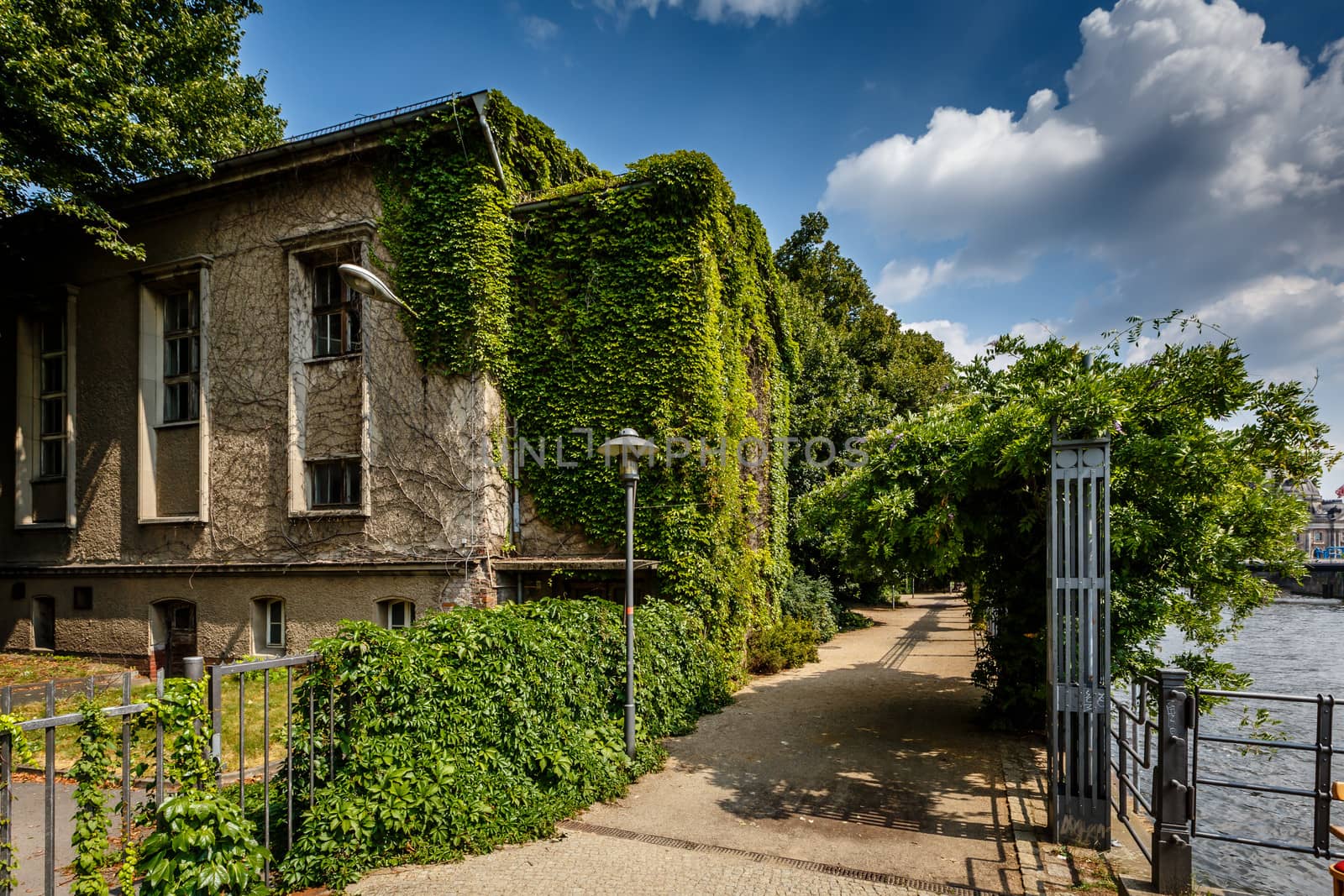 River Spree Embankment and House with Grape Vines, Berlin, Germany