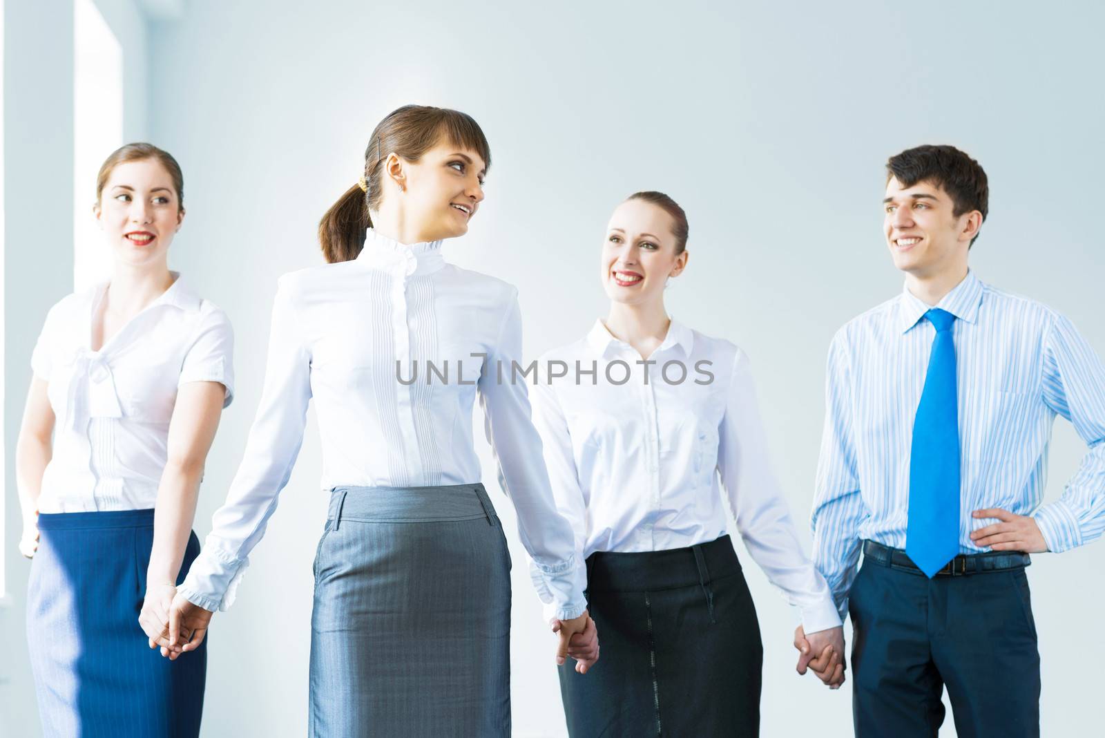 leadership team, a group of business people standing in a number of hand-in-hand, the leader stepped forward