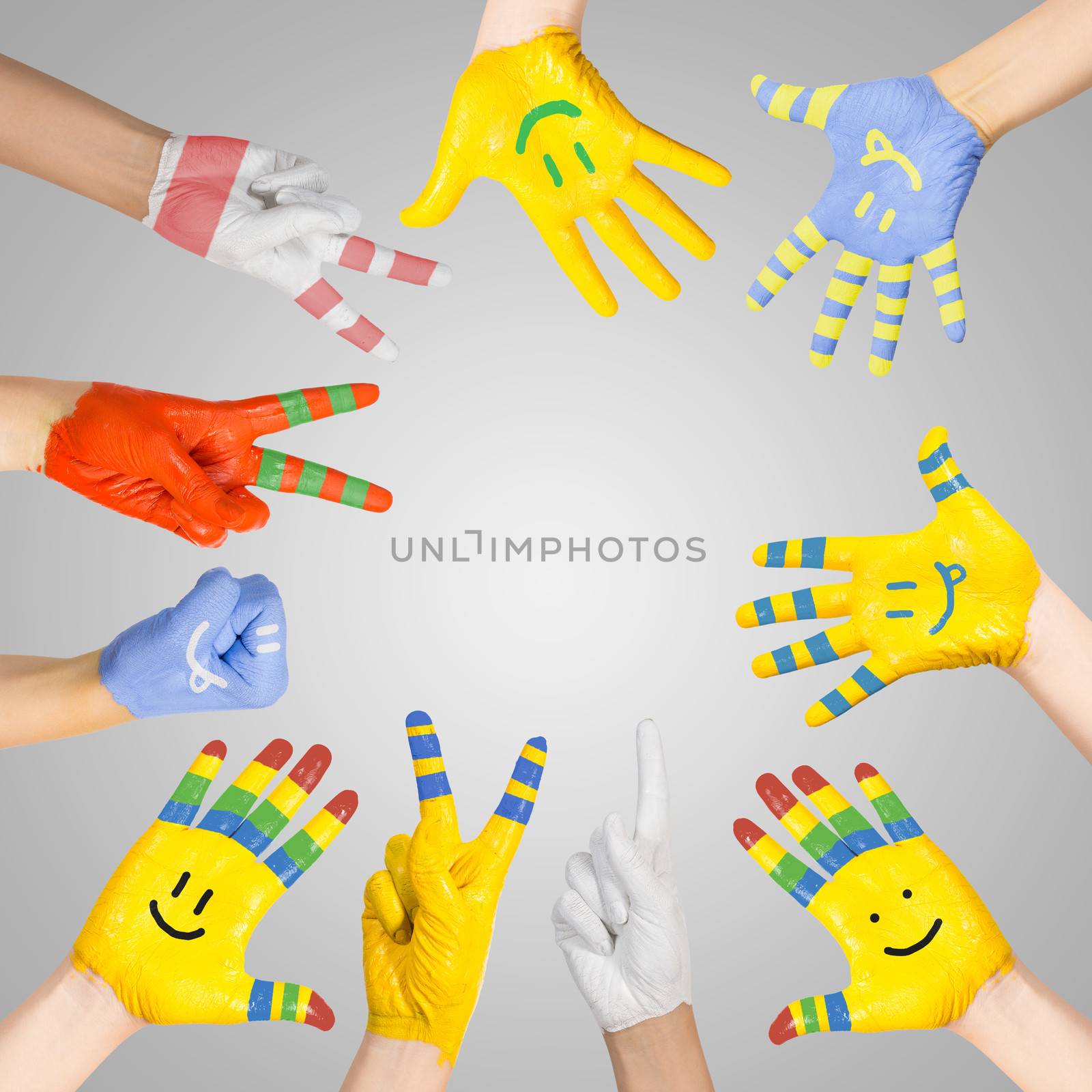 painted children's hands in different colors with smilies