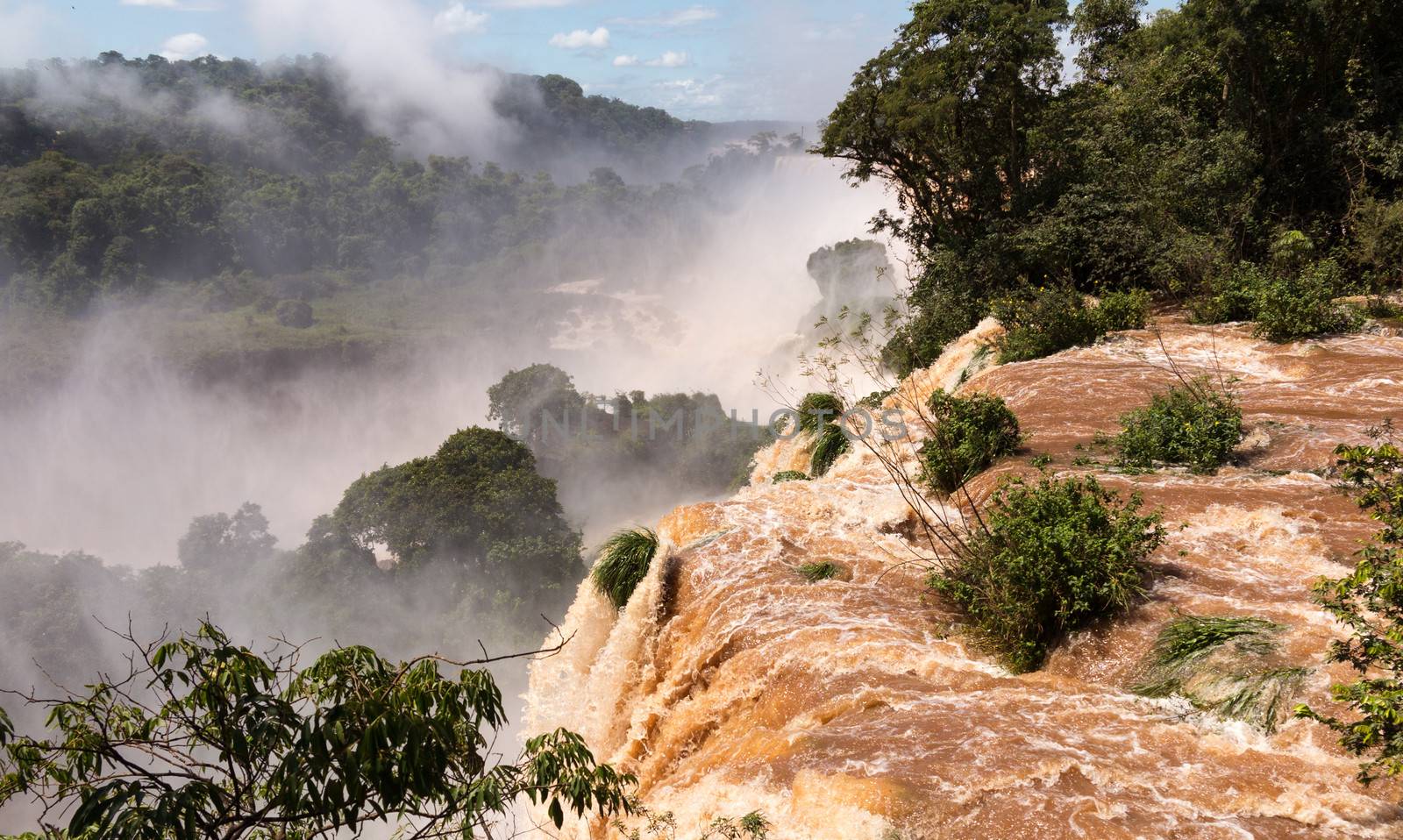 Flood swollen river leading to famous Iguassu Falls on border between Brazil and Argentina