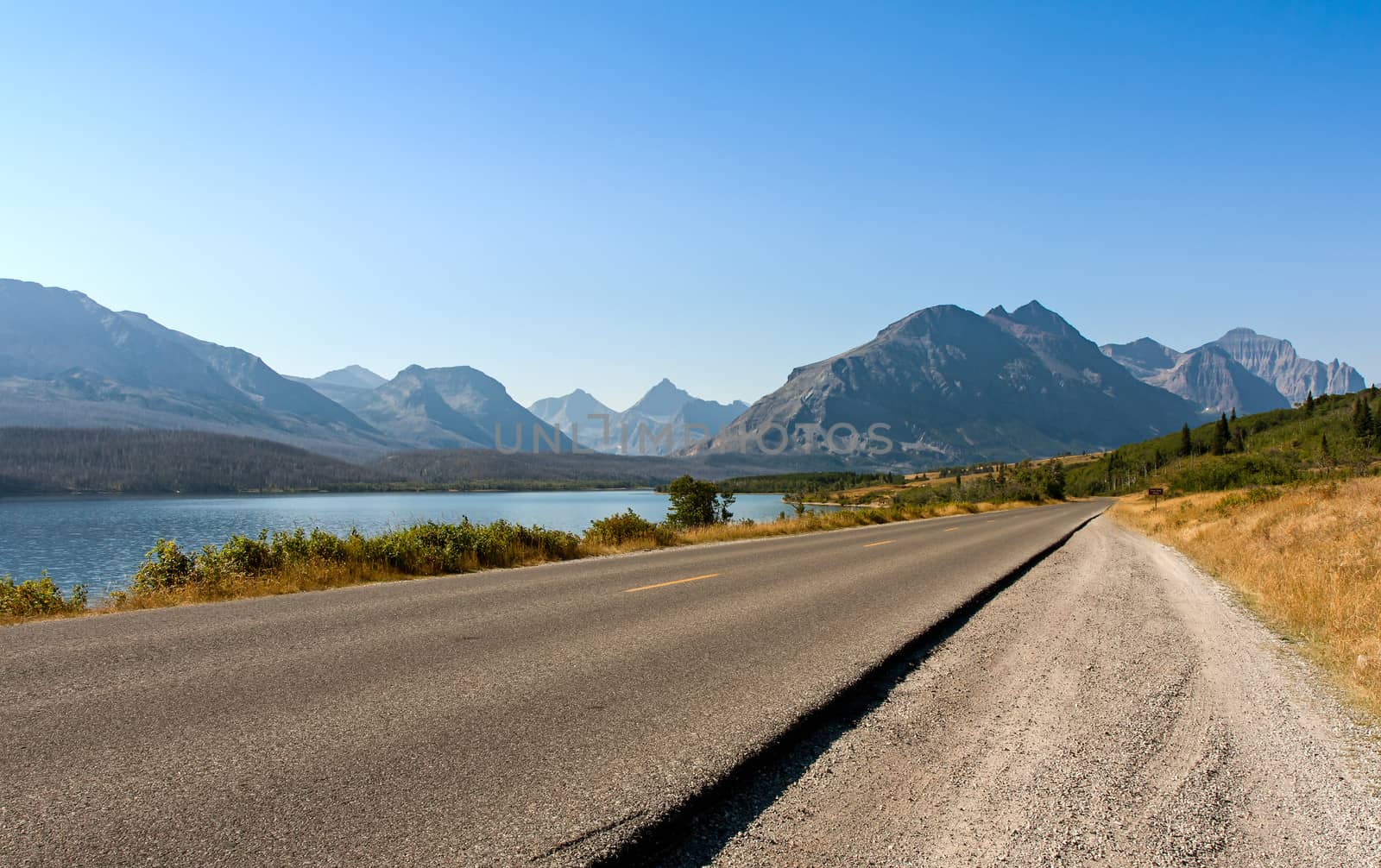 This image showing the lake on the left and the mountains in the background is on the drive into Glacier National Park from the East.