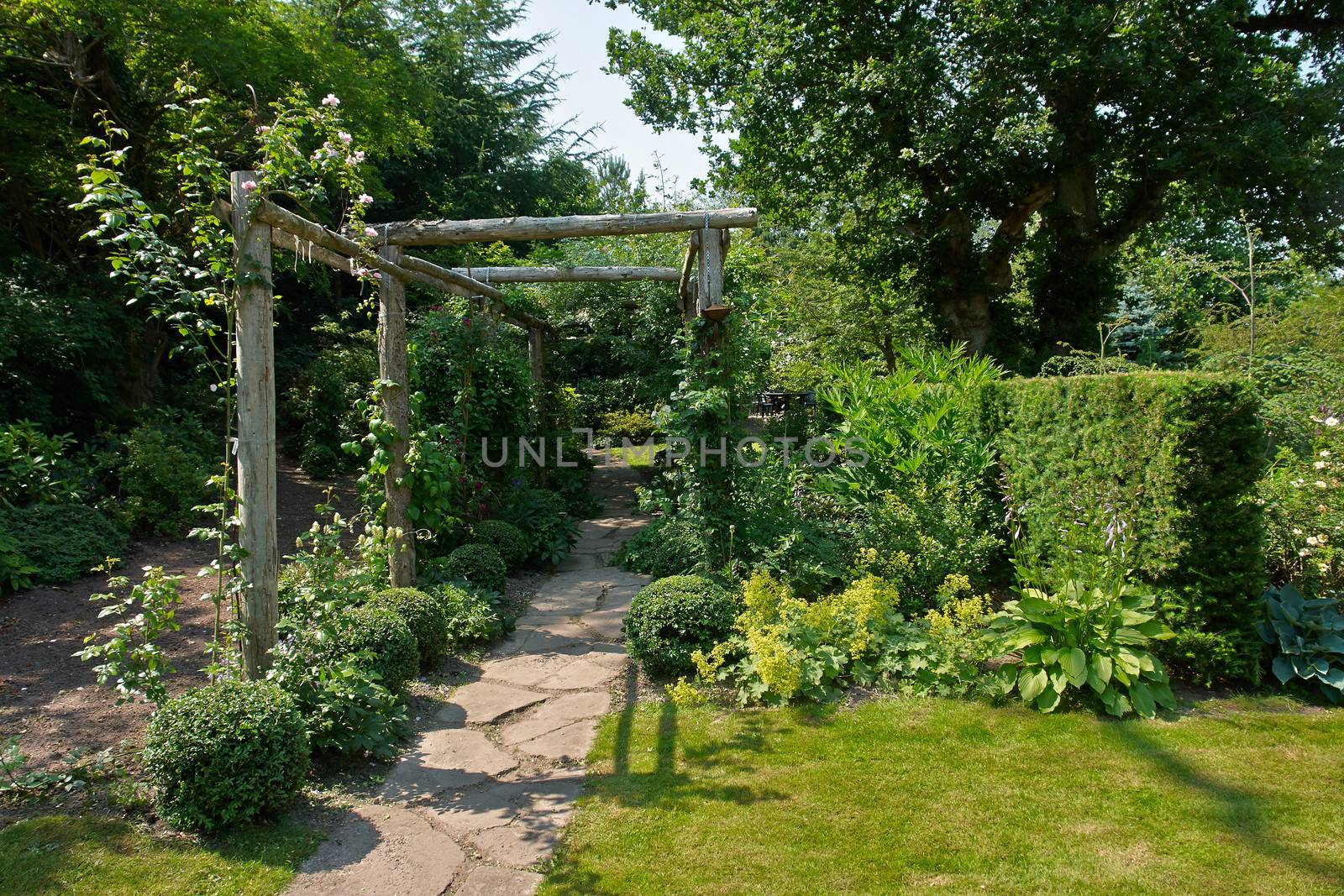Beautiful gardening project - creative garden tunnel archway in a classical garden