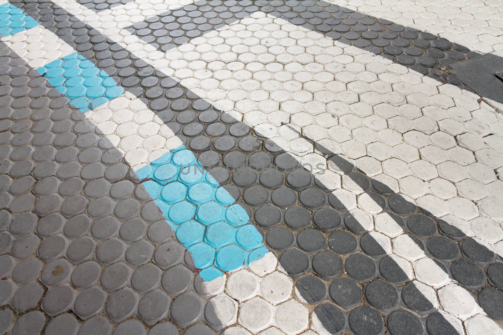 White and blue Traffic Line On Concrete paving block