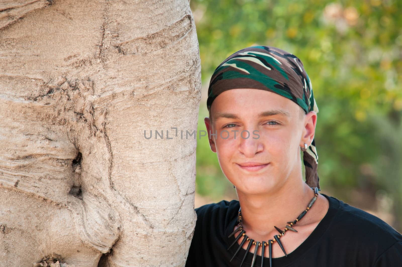 Portrait of a teenage boy in bandana.