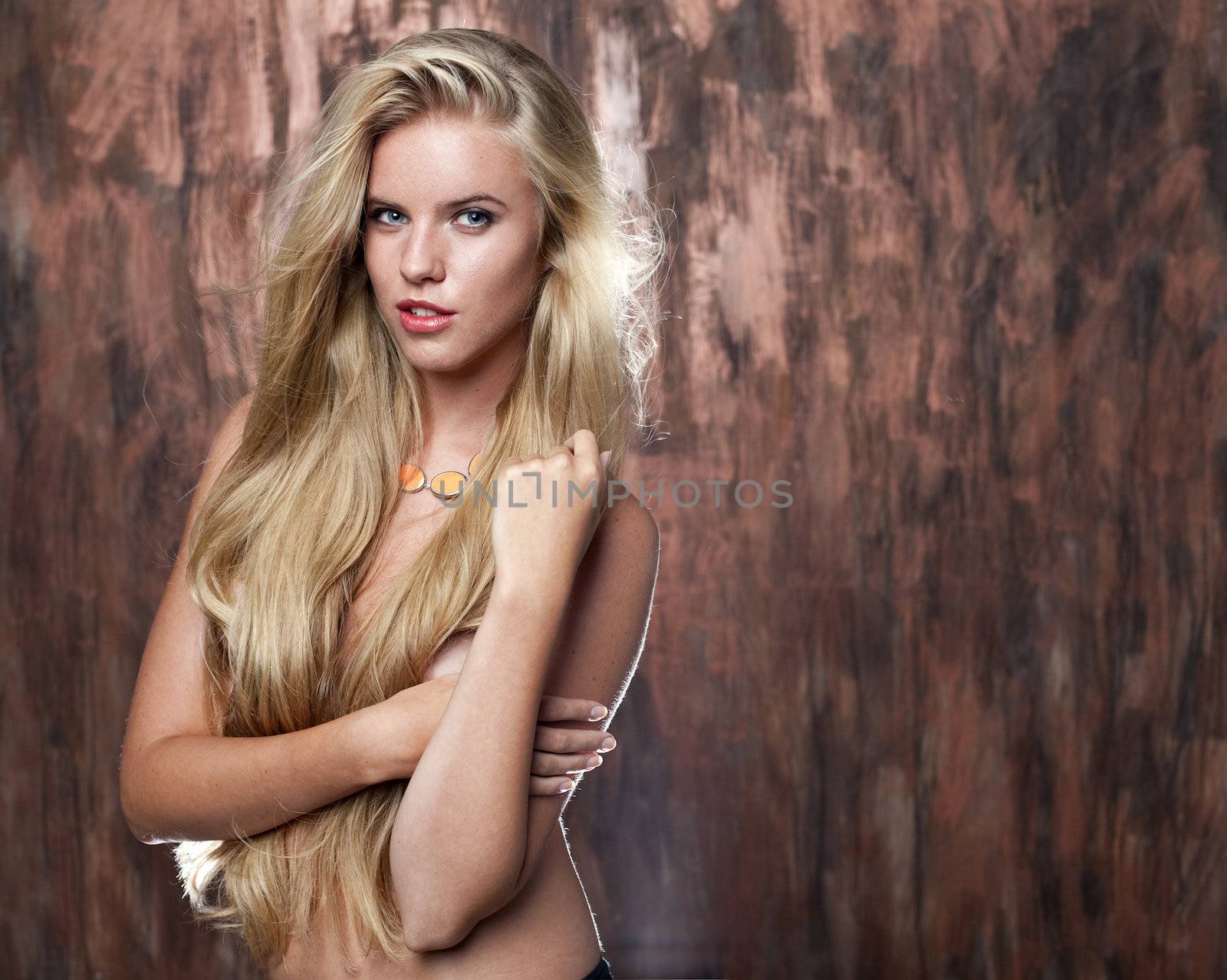 Sexy nude model in dark studio