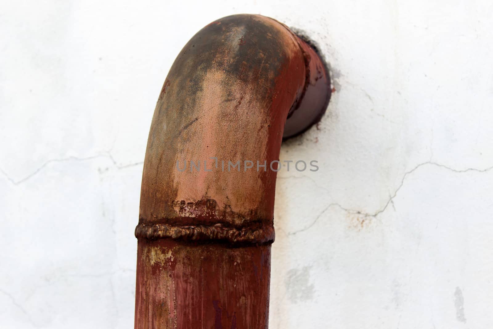 Rusty water pipe and  peeling paint by photo2life