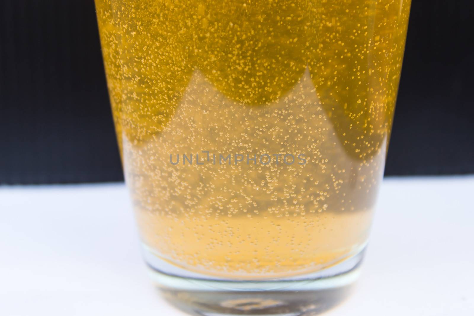 Orange bubbles in glass