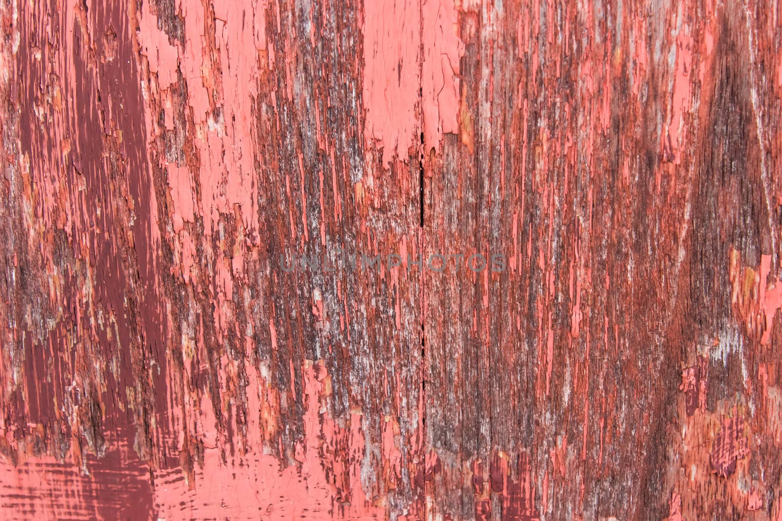 close-up red wood  peeling paint