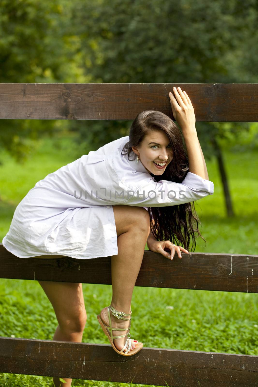 Sexy young Brunette in a summer park