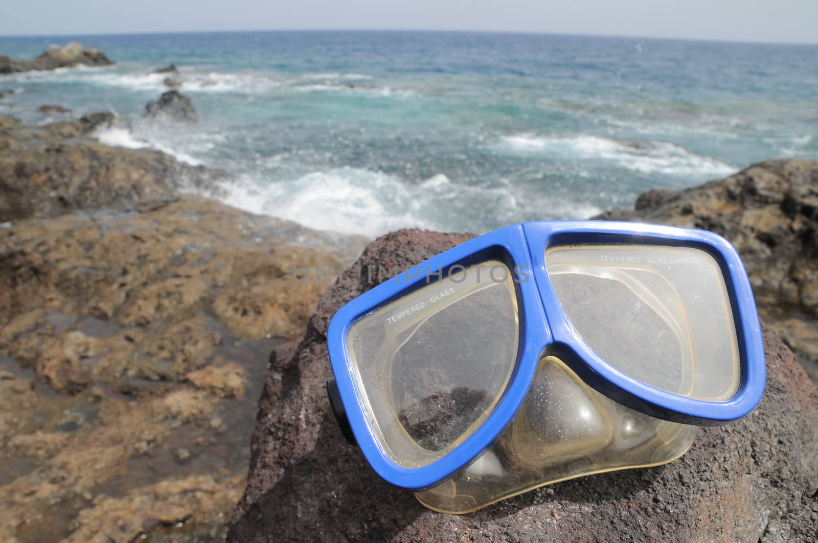 Blue Old Diving Mask on the Rocks near the Beach 