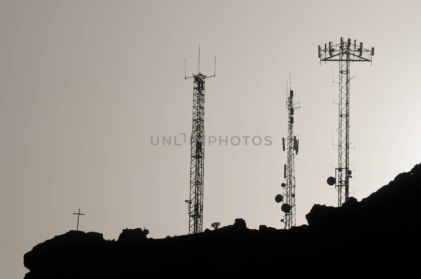 Some Silhouetted Antennas on the top of a Hill