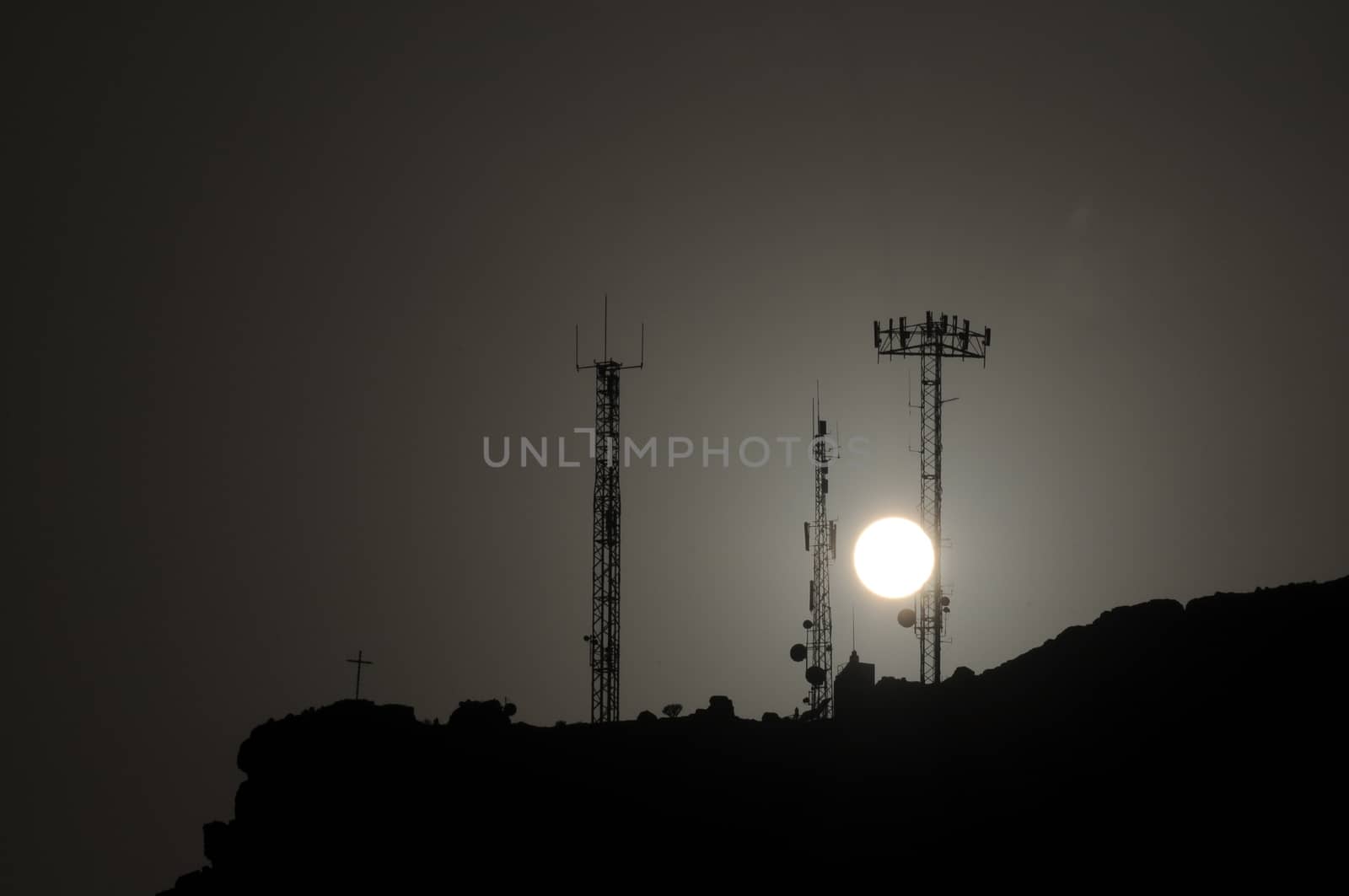 Some Silhouetted Antennas on the top of a Hill