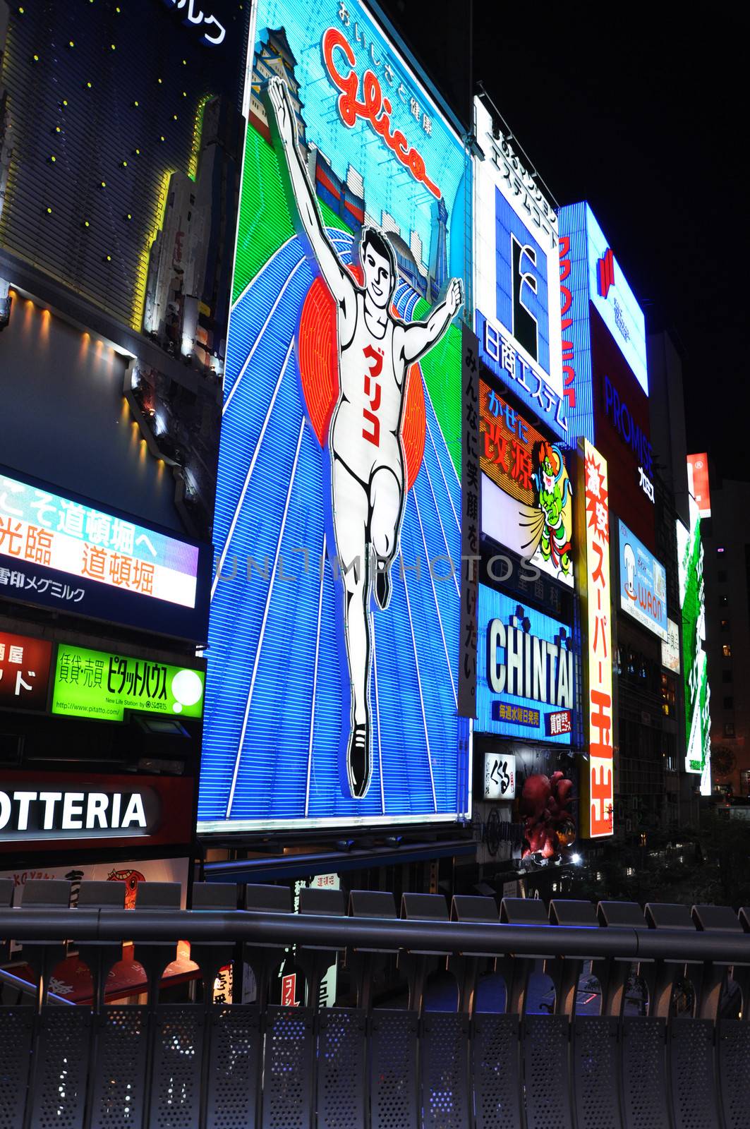 OSAKA, JAPAN - OCT 23: The Glico Man Running billboard and other by siraanamwong