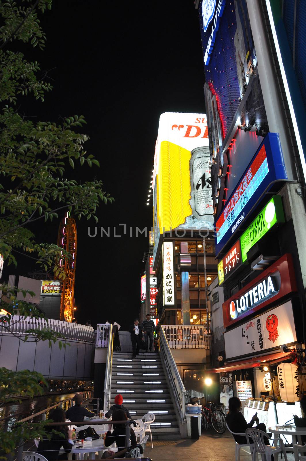 OSAKA, JAPAN - OCT 23: People visit famous Dotonbori street on October 23, 2012 in Osaka, Japan. According to Tripadvisor Dotonbori is the 3rd best attraction to visit in Osaka. 