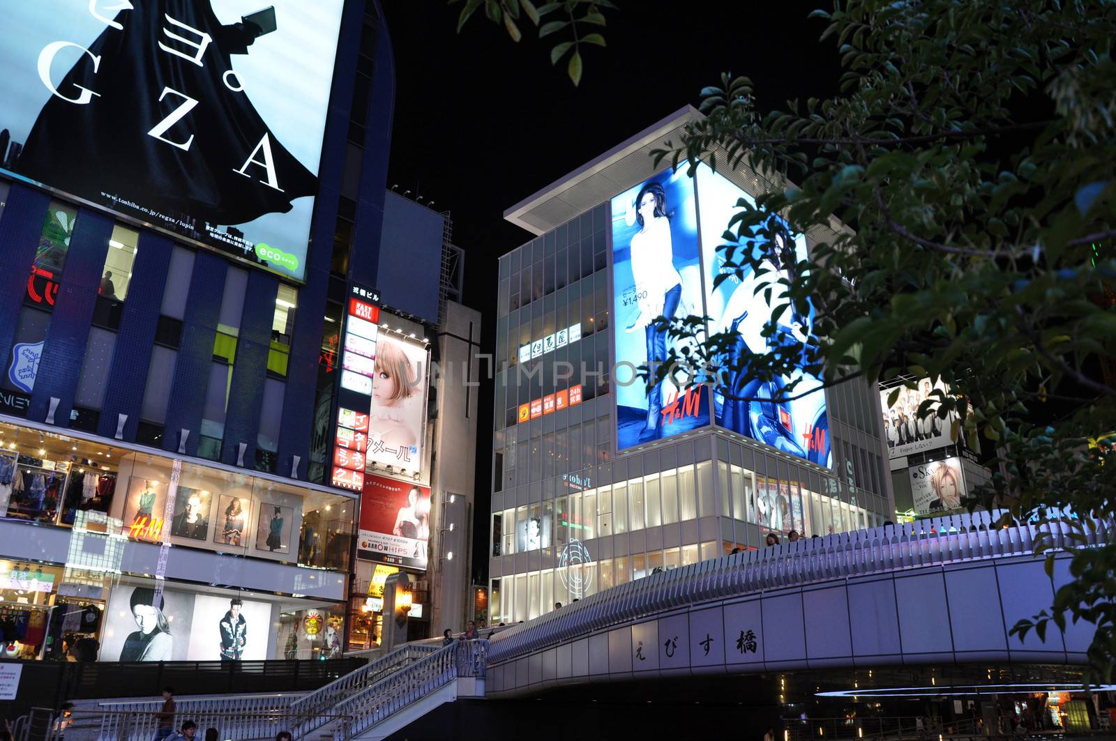 OSAKA, JAPAN - OCT 23: People visit famous Dotonbori street on October 23, 2012 in Osaka, Japan. According to Tripadvisor Dotonbori is the 3rd best attraction to visit in Osaka. 