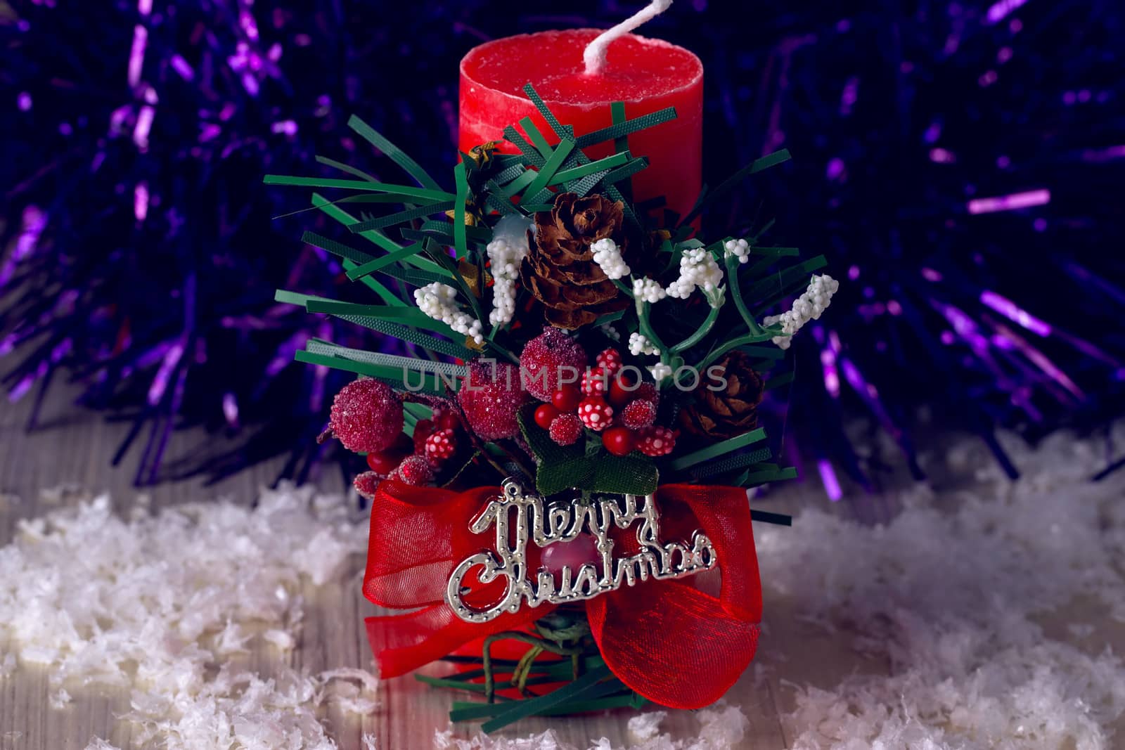 Decorative christmas composition from red candle