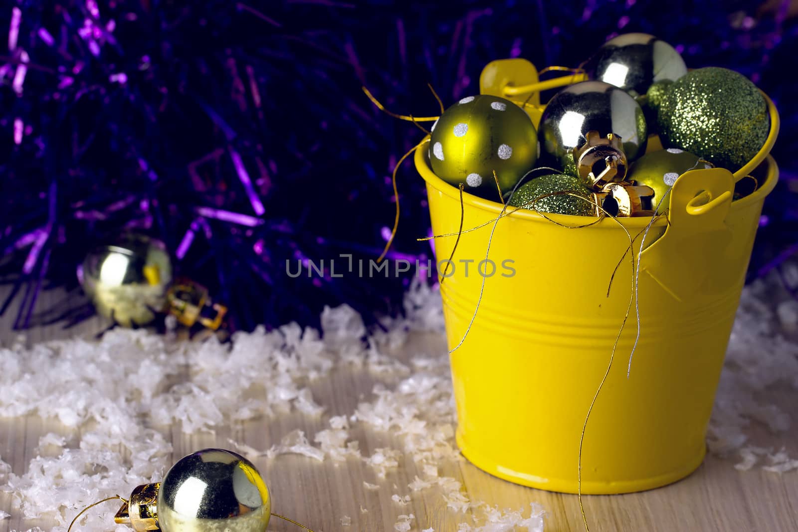 Christmas ornaments in a decorative bucket