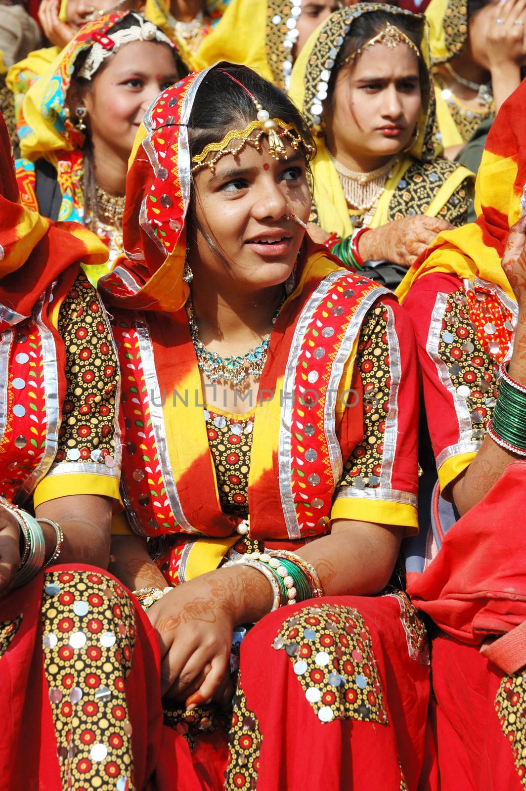 PUSHKAR, INDIA - NOVEMBER 21: Young women  are preparing to perfomance at annual camel fair holiday in Pushkar on November 21,2012 in Pushkar, Rajasthan, India