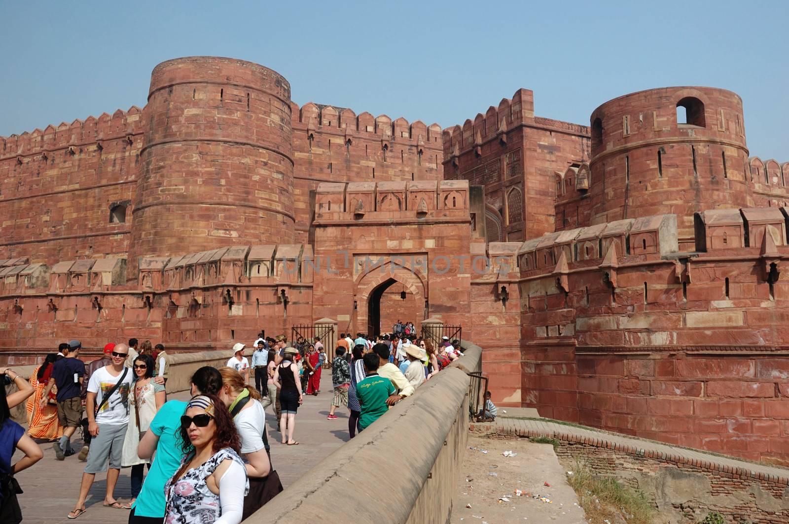 AGRA, UTTAR PRADESH, INDIA - NOVEMBER 18: Crowd of tourists are entering  the famous Agra Fort - the old Mughal Empire capital and a UNESCO World Heritage Site on November 18,2012 in Agra, India