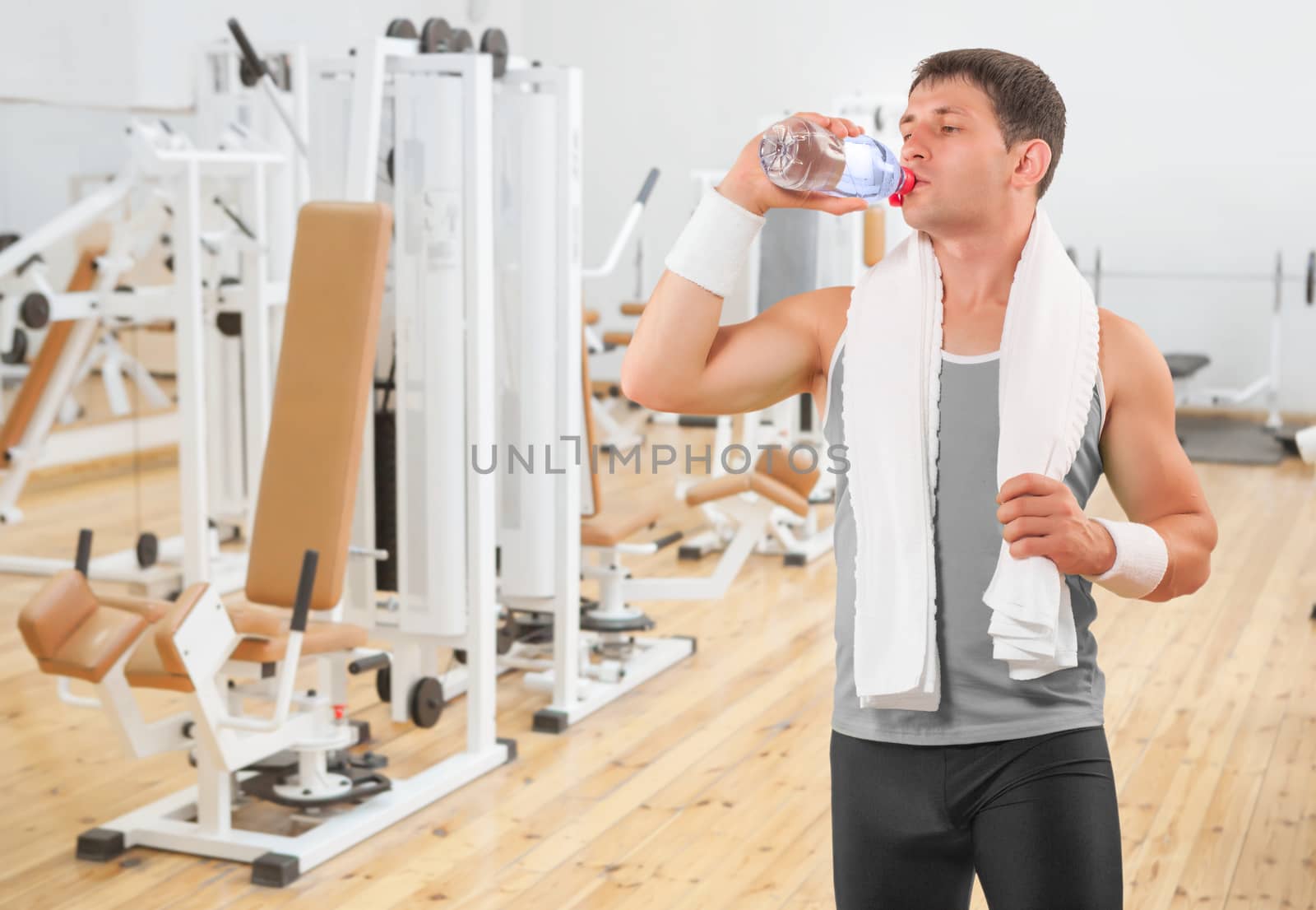 a sportsman drinking water from bottle