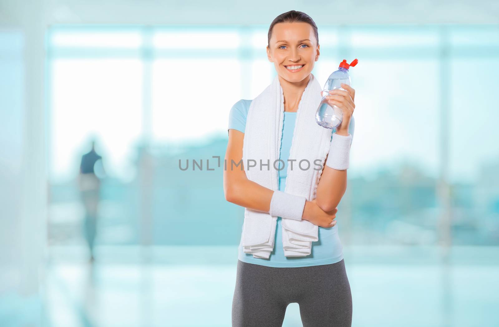 a sportswoman with bottle of water