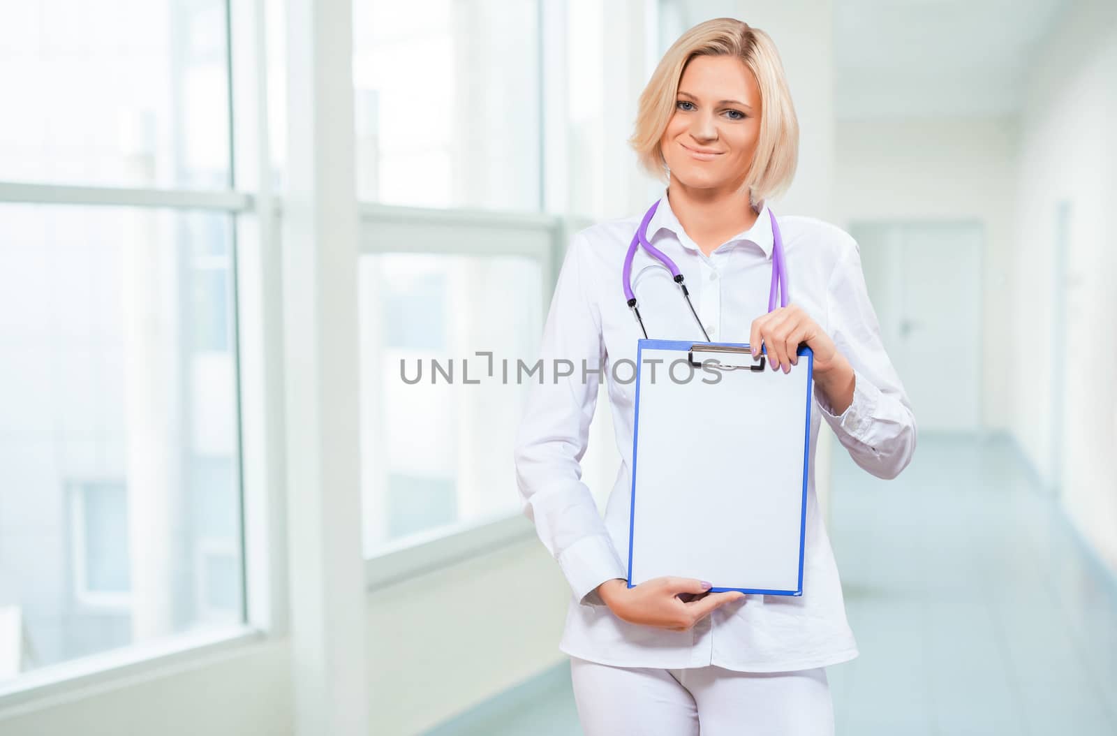 female doctor holding empty clipboard